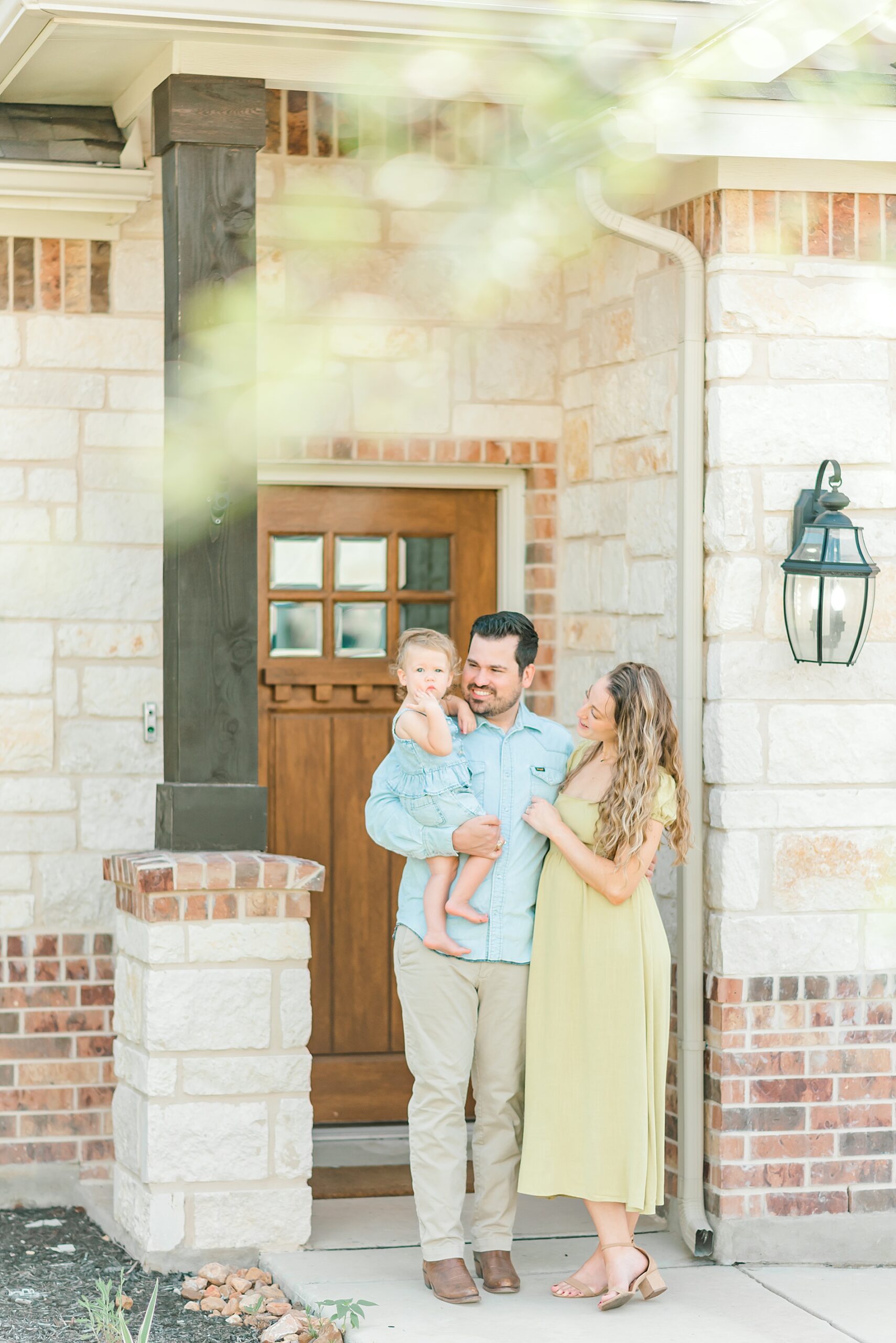 family stands outside of home in San Antonio TX