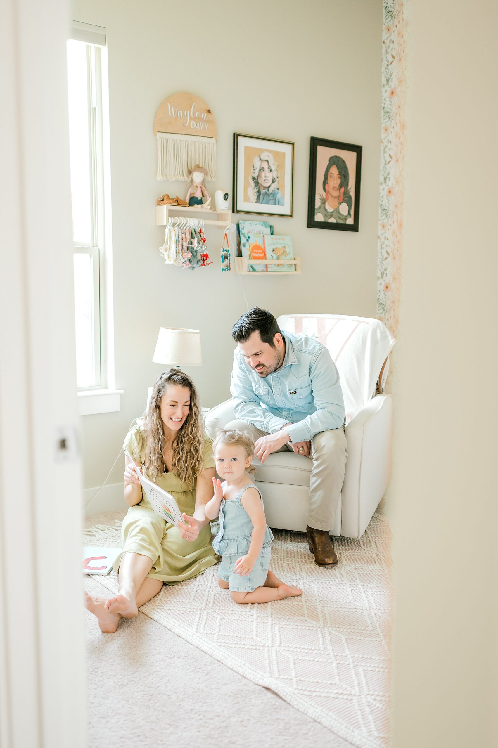 family reads a book together during Candid In-Home Family Session