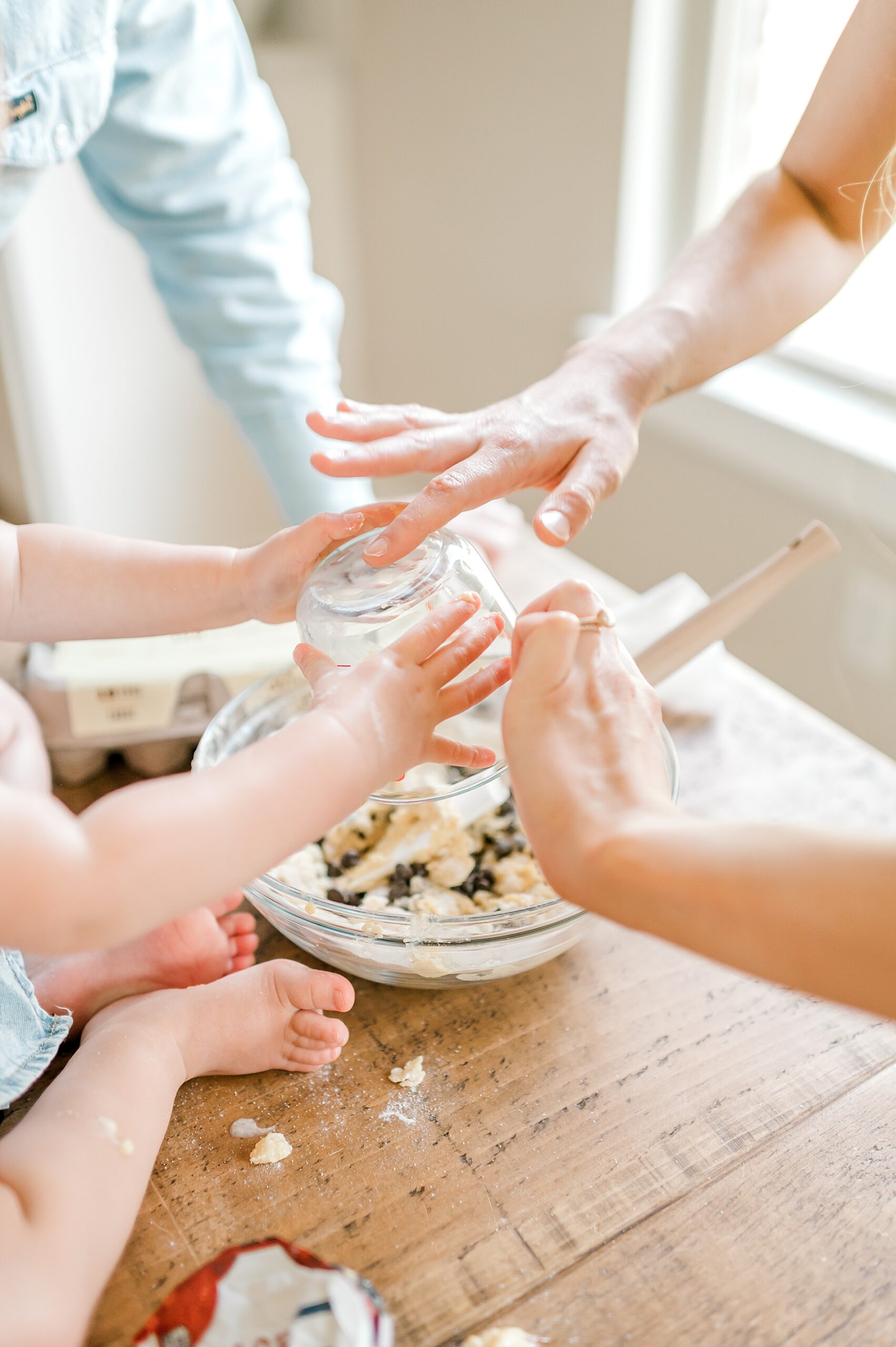 little girl helps bake in the kitchen 