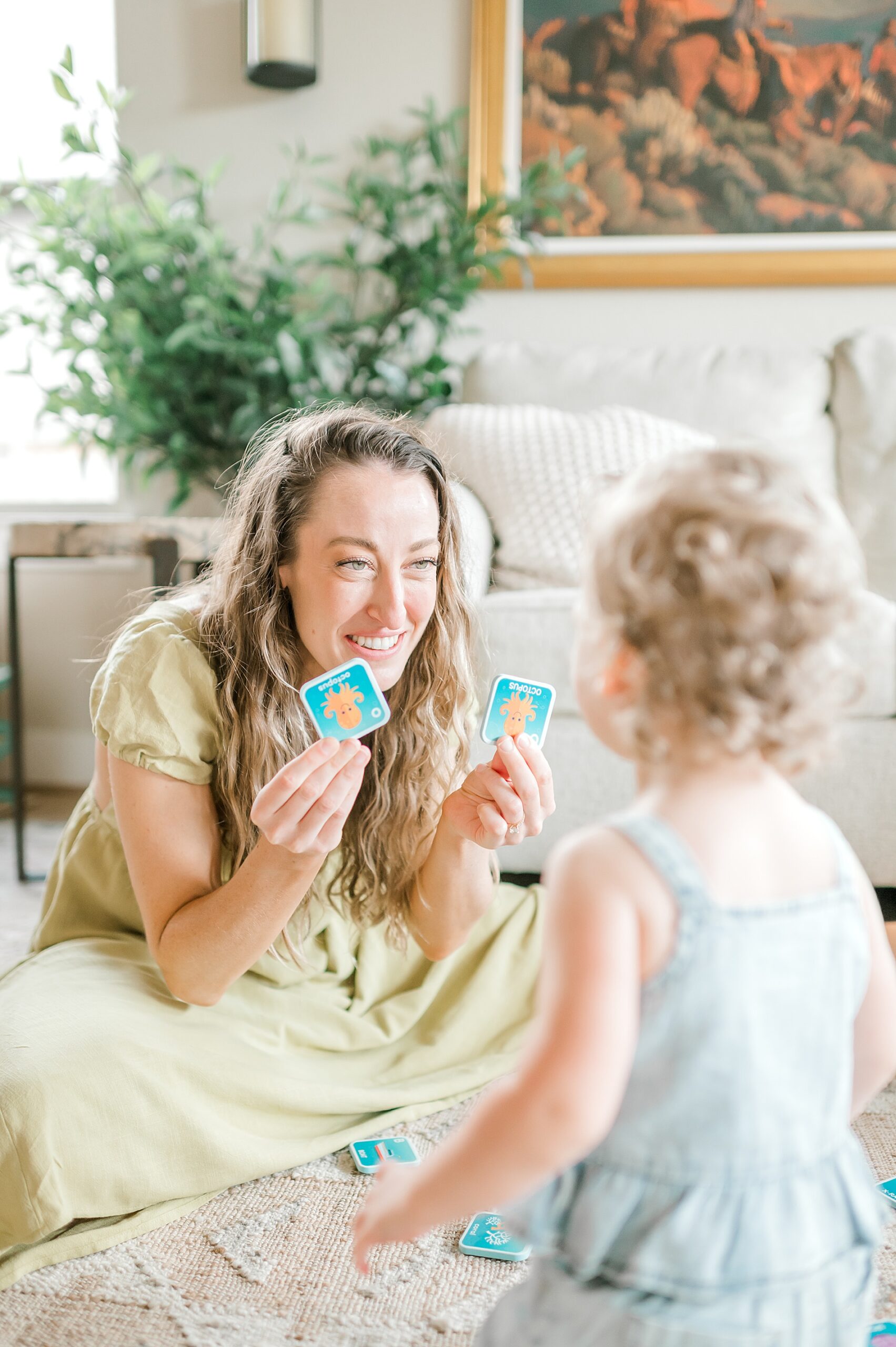 mom plays with her daughter