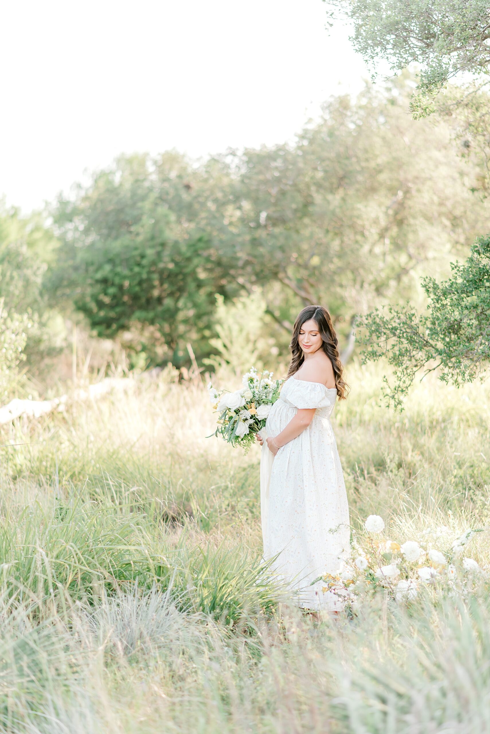 pregnant woman in tall grass from Whimsical Maternity Session  