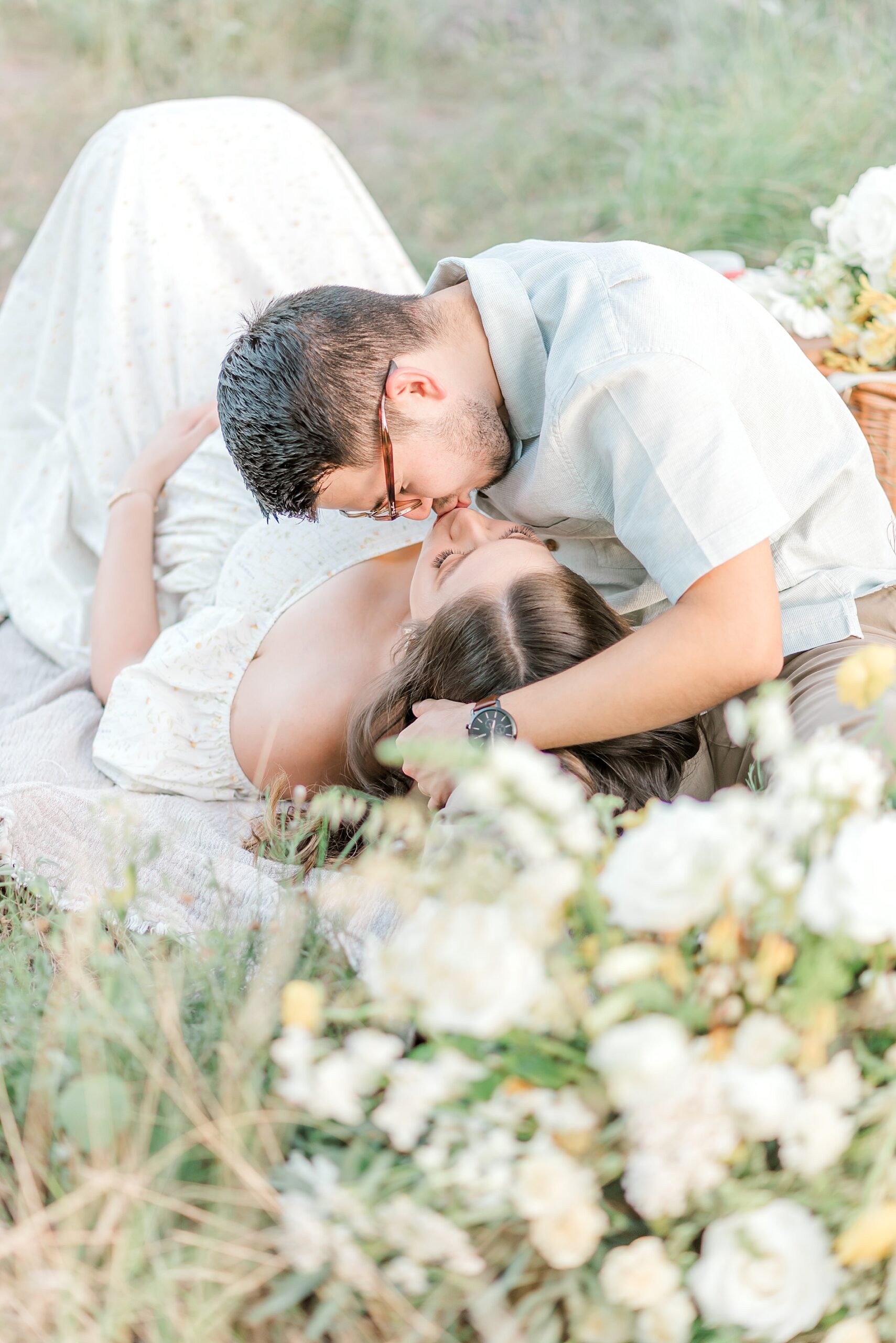 couple kiss during San Antonio, TX maternity session