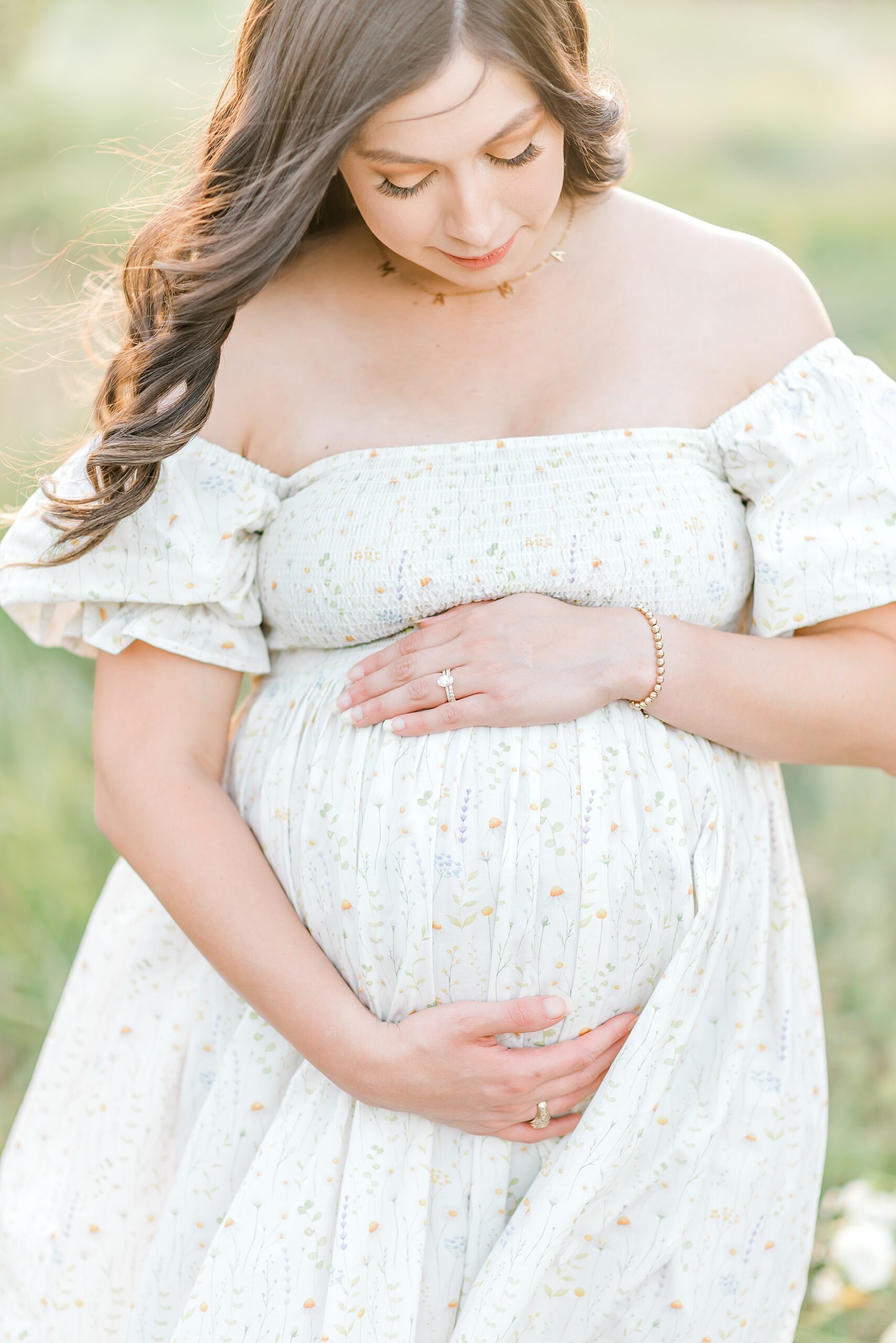 pregnant woman holds baby bump