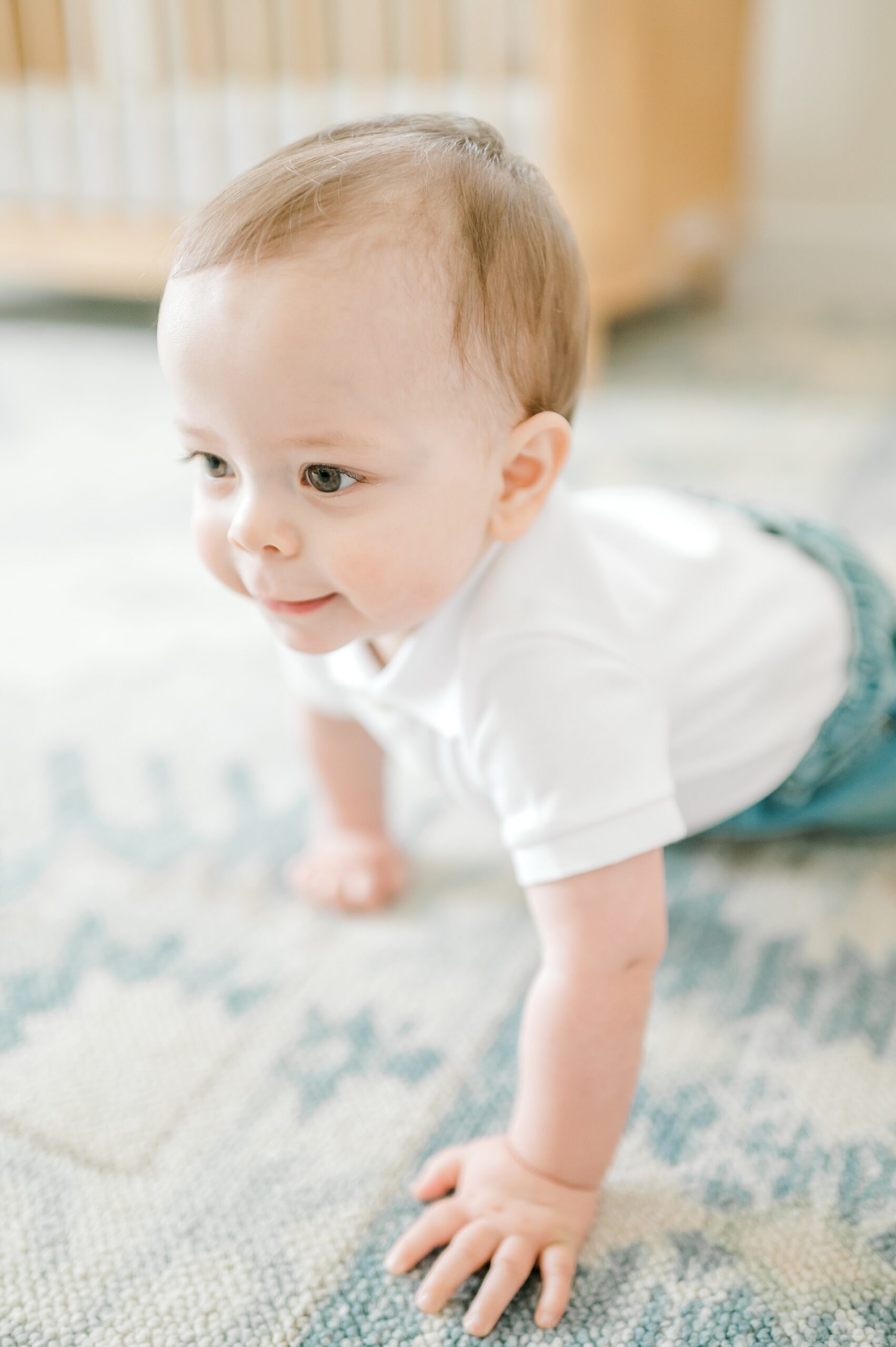 curious one-year old crawls across his floor