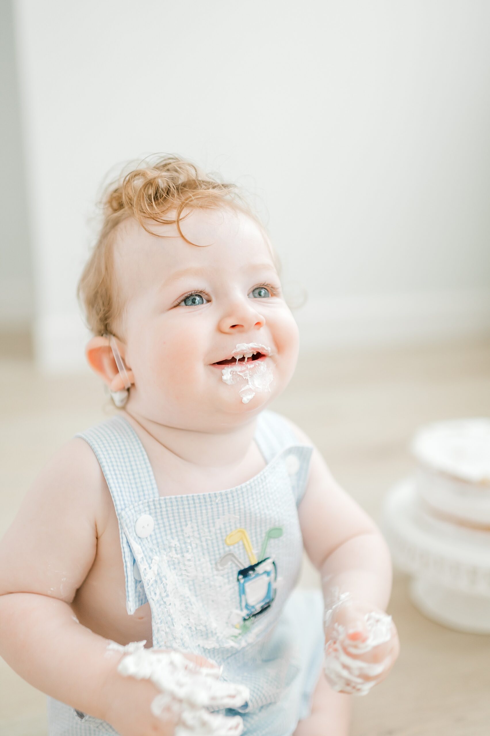 candid photo of little boy during cake smash