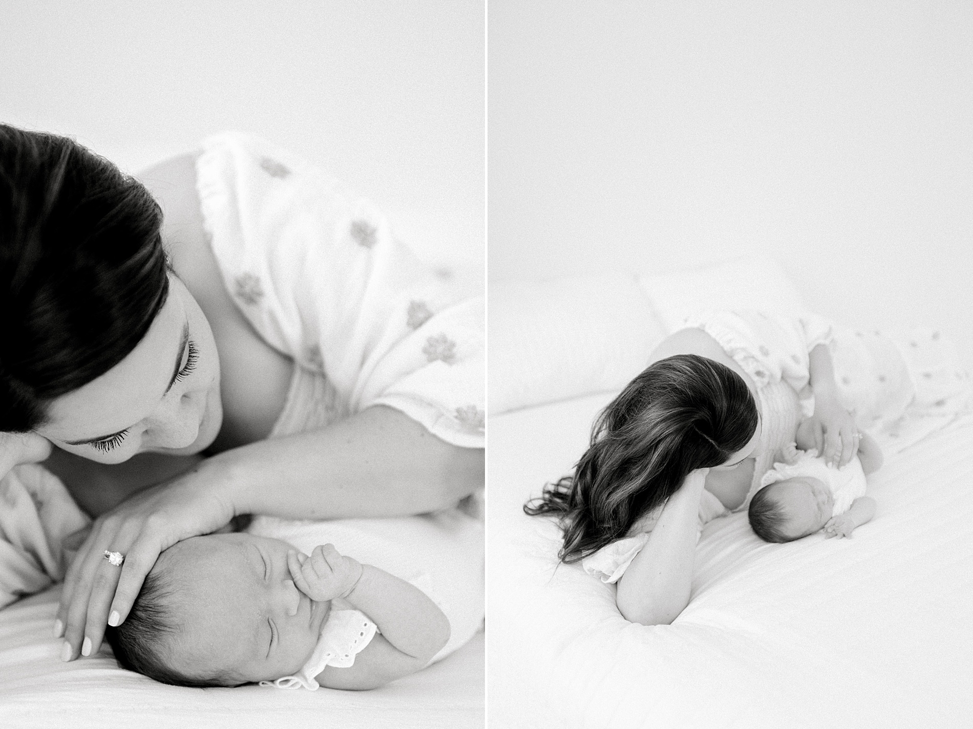 mom lays on bed cuddling close with her newborn girl