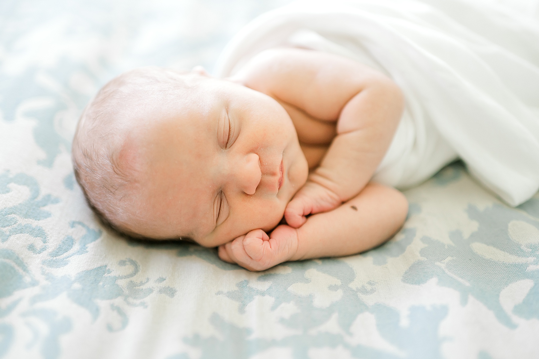 delicate features of sleeping newborn