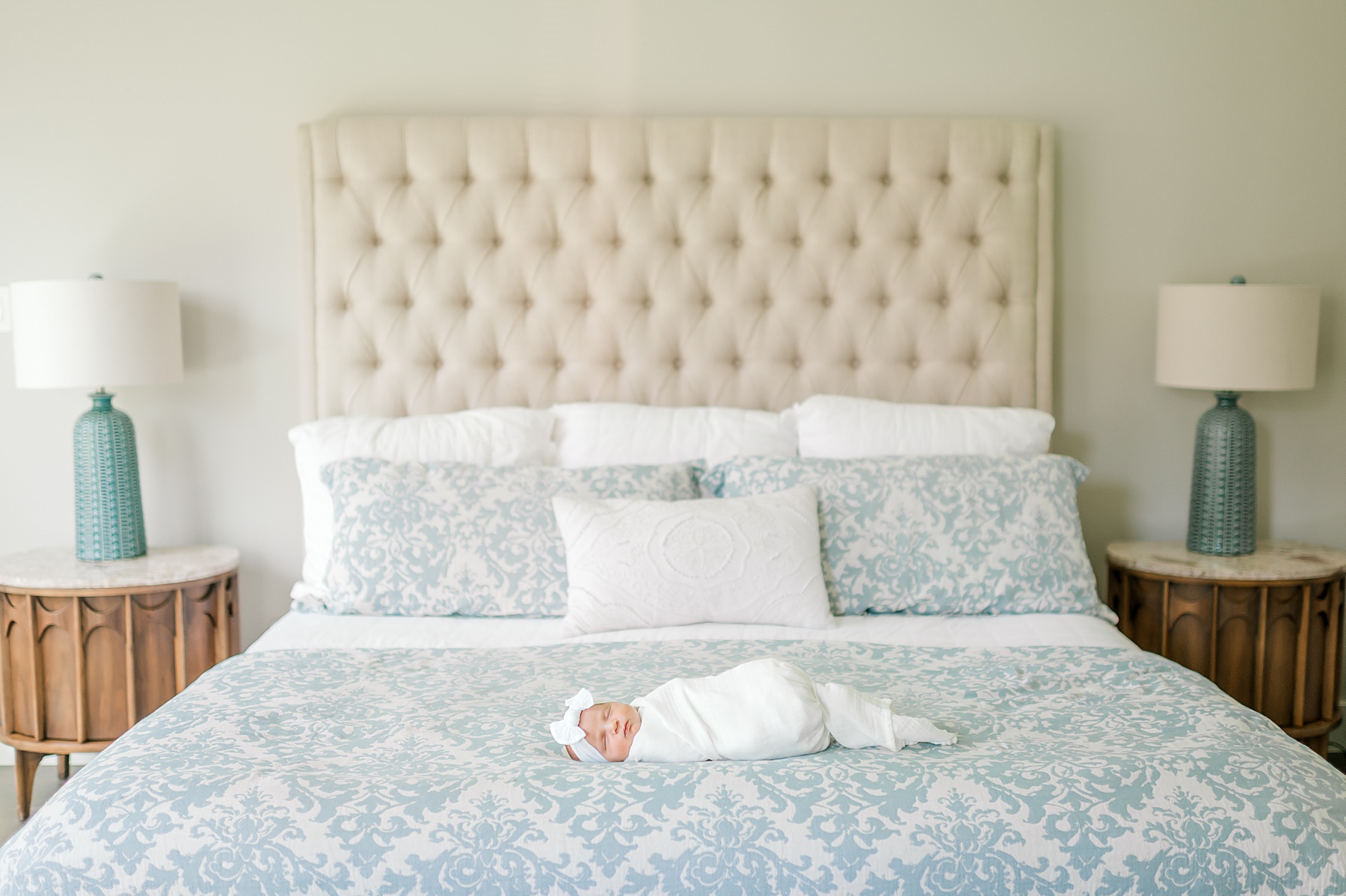 newborn girl sleeps in bed