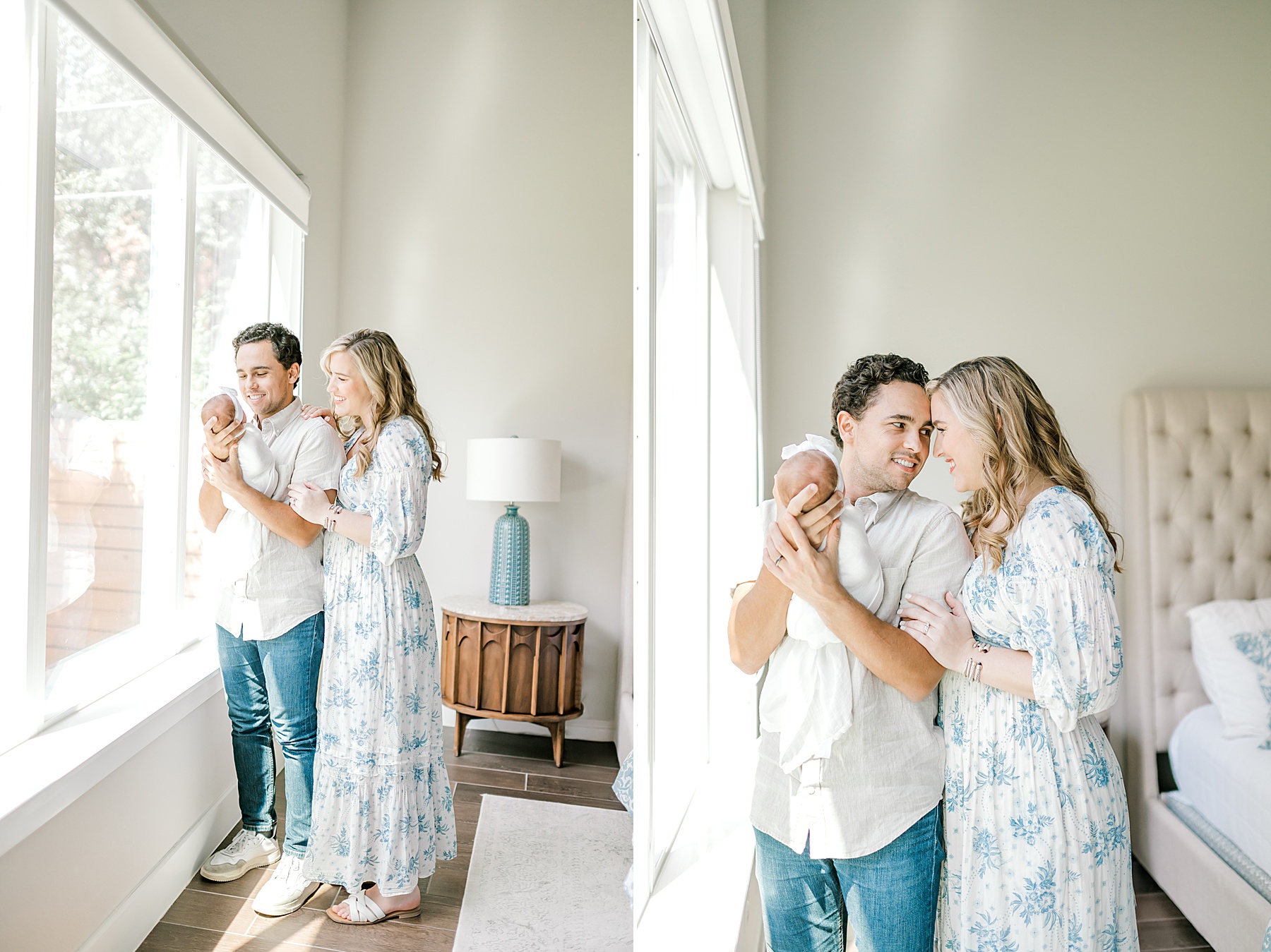 parents hold newborn by window 