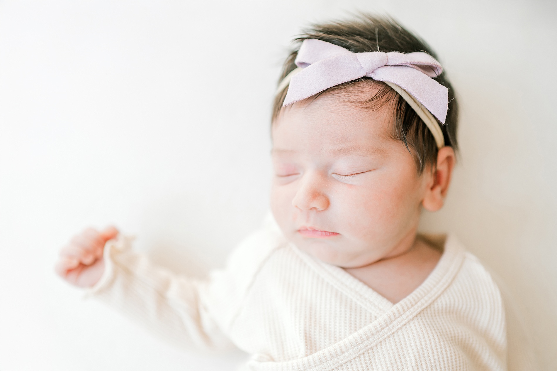 newborn girl sleeps during in-home newborn session in San Antonio TX