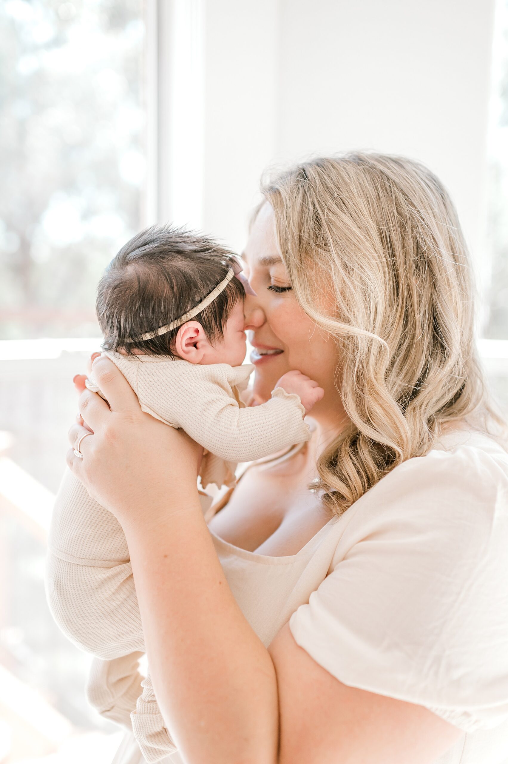 mom holds newborn girl