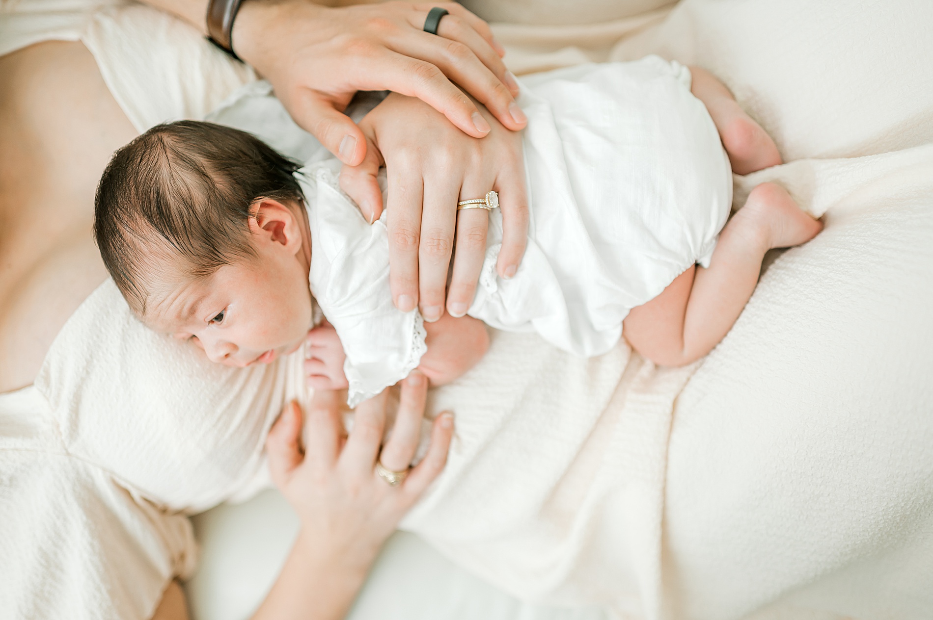 newborn lays with mom