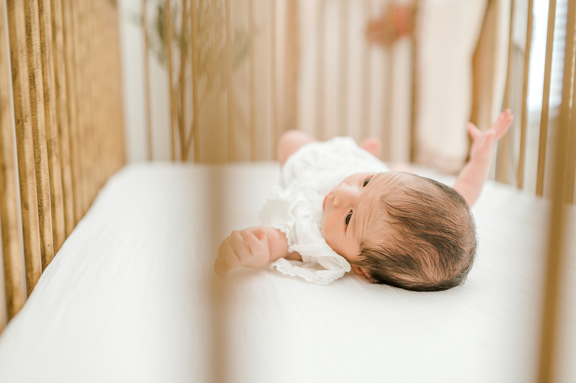 newborn in crib