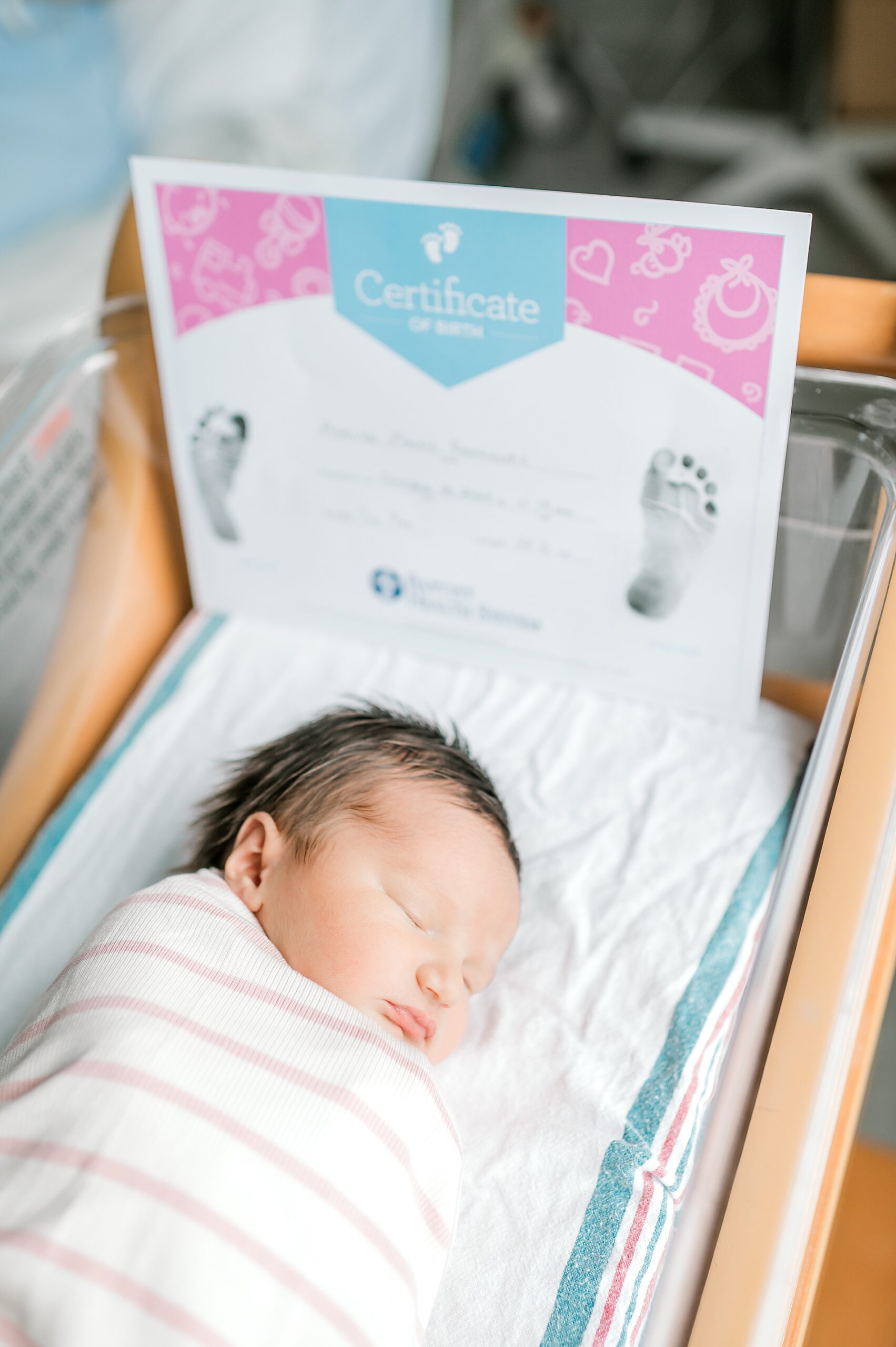 newborn sleeps in bassinet at hospital 