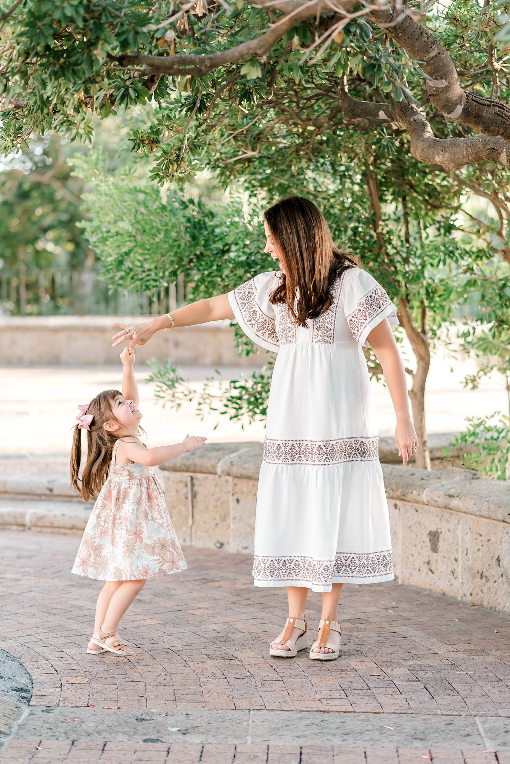 mother twirls her daughter around