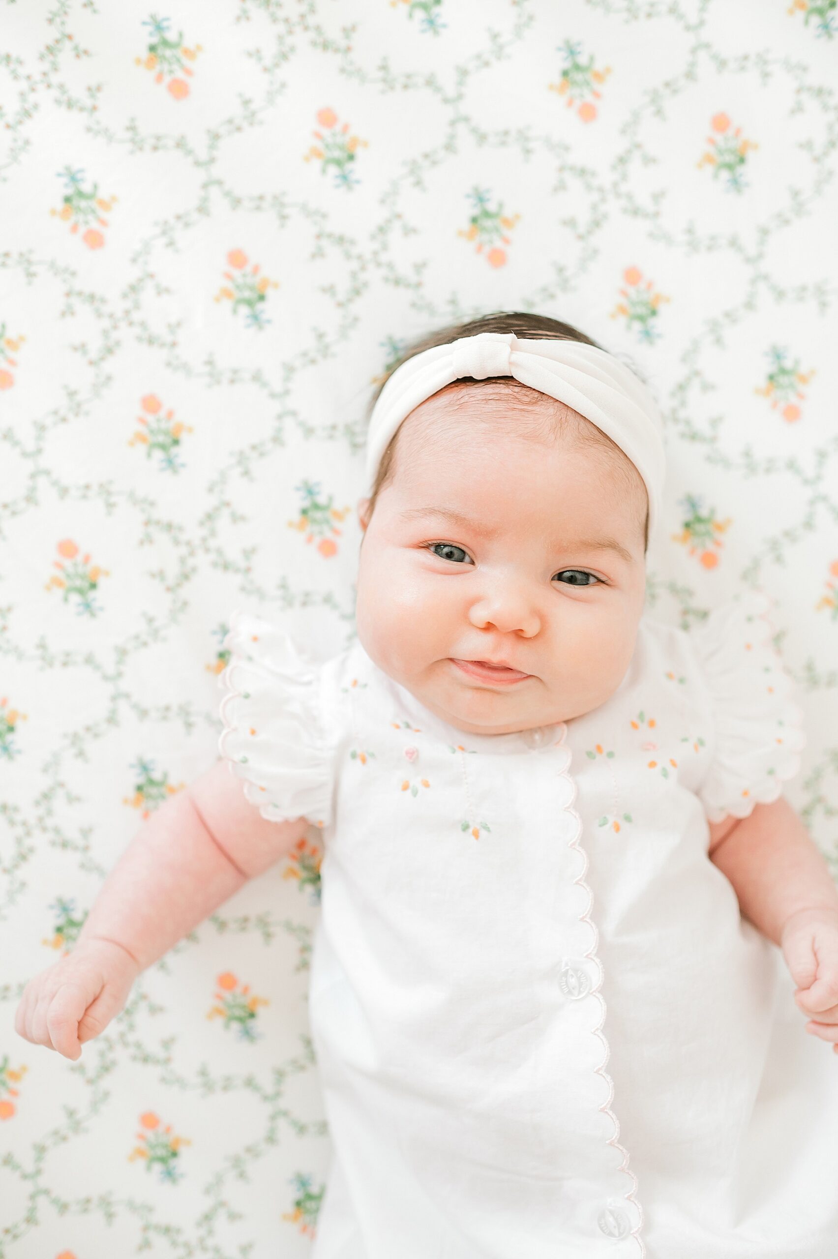 newborn girl in crib