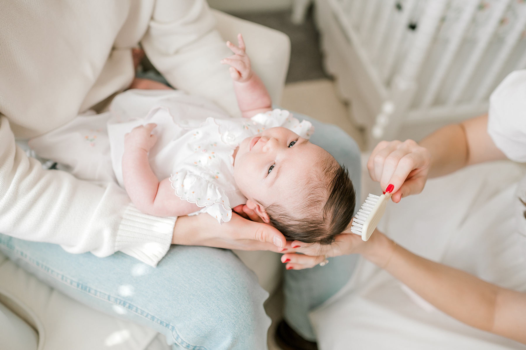 mom combs baby's hair