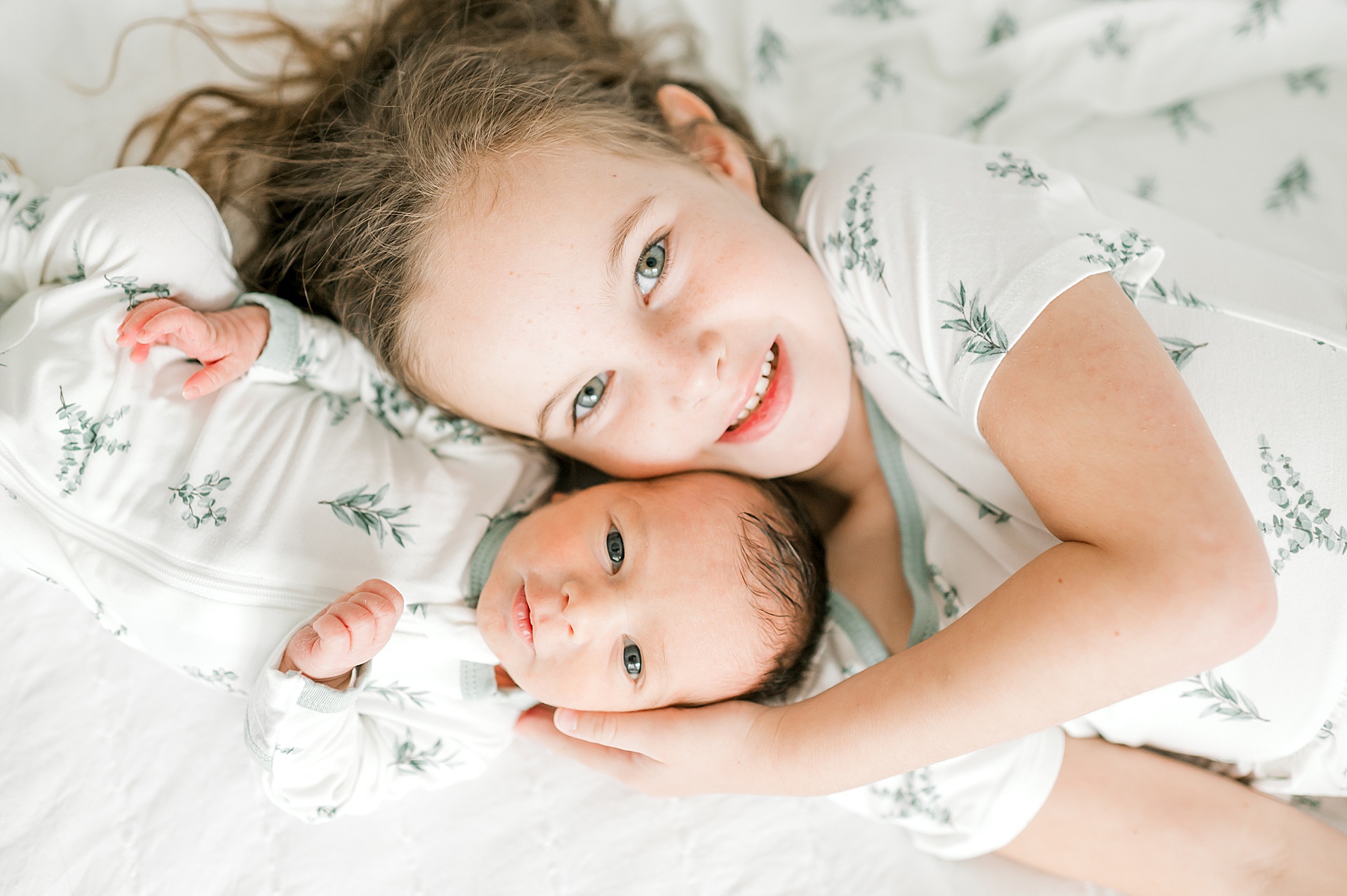 big sister with newborn brother