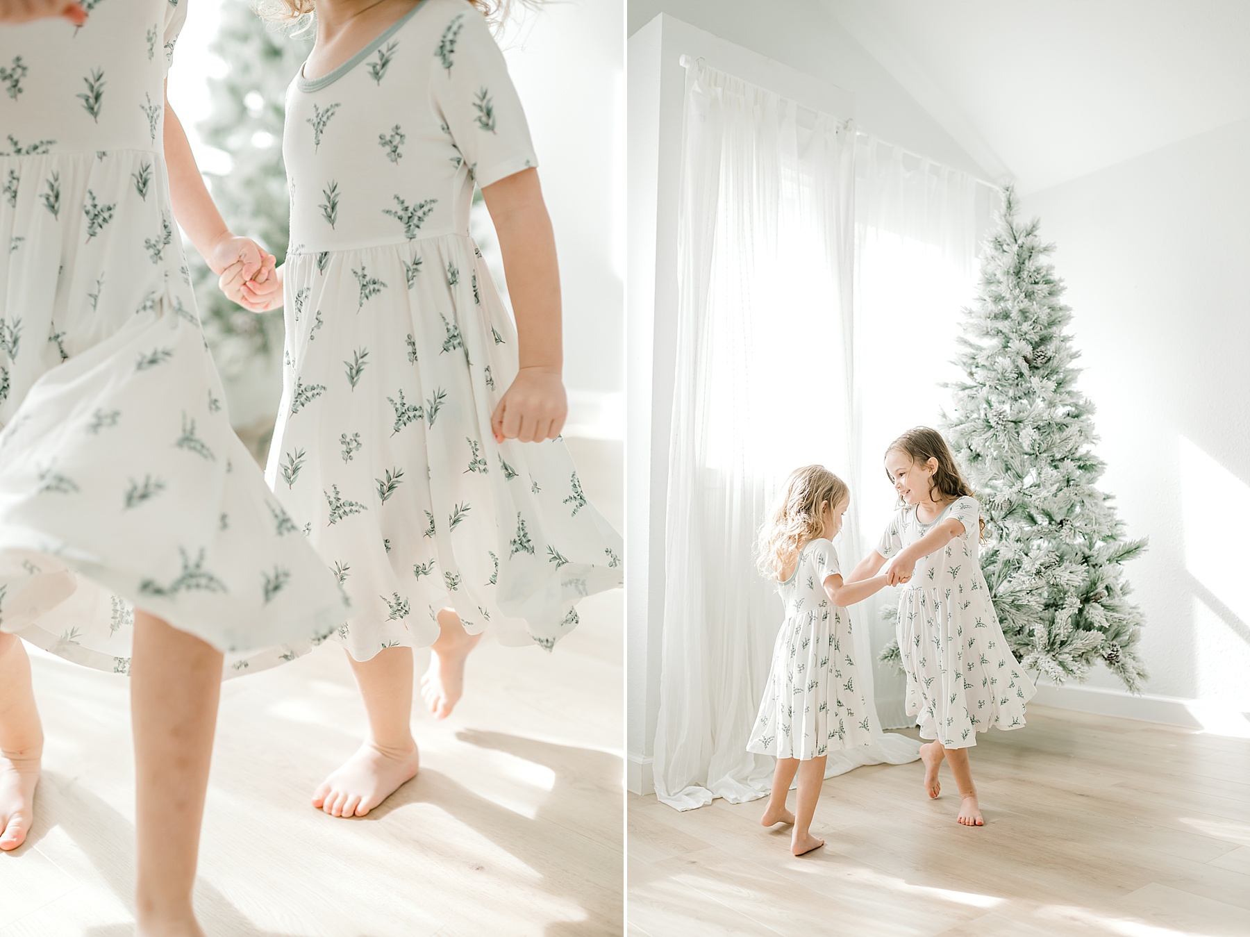 sisters dance by Christmas tree during December Studio Newborn Session