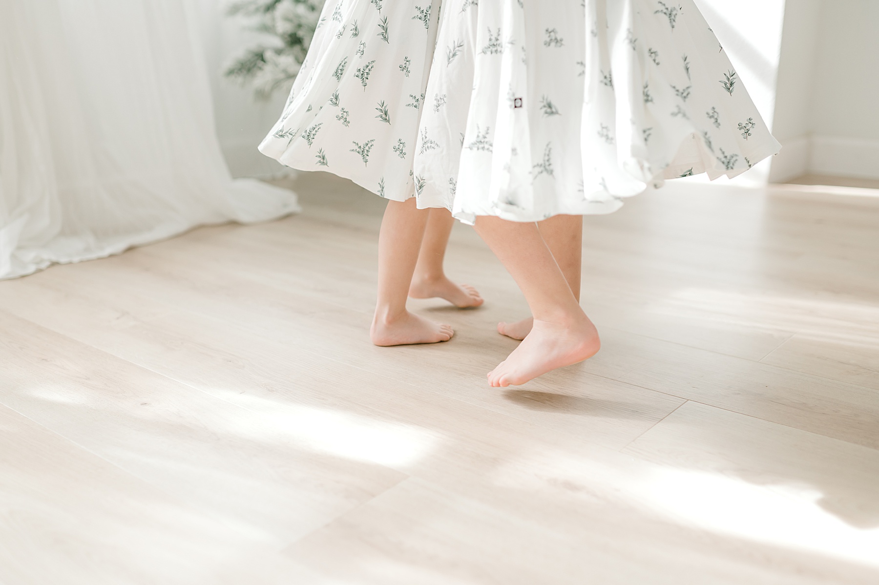 girls twirl in their matching dresses