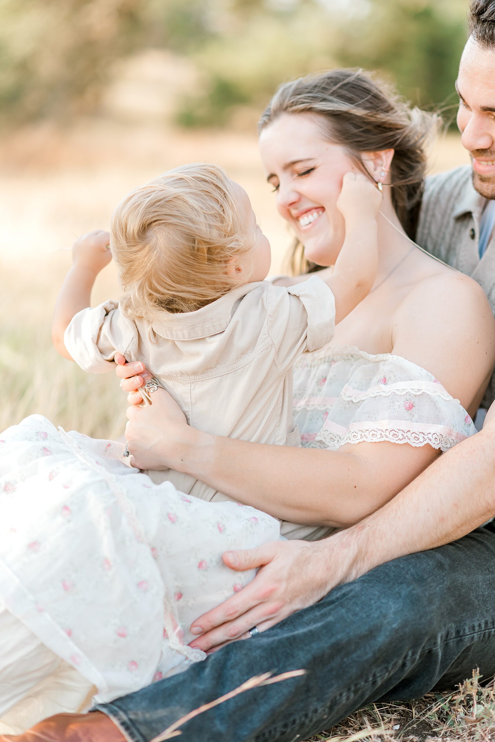 parents hold son during Bullis County Park family session | Why Full Family Sessions Can Benefit Young Kids