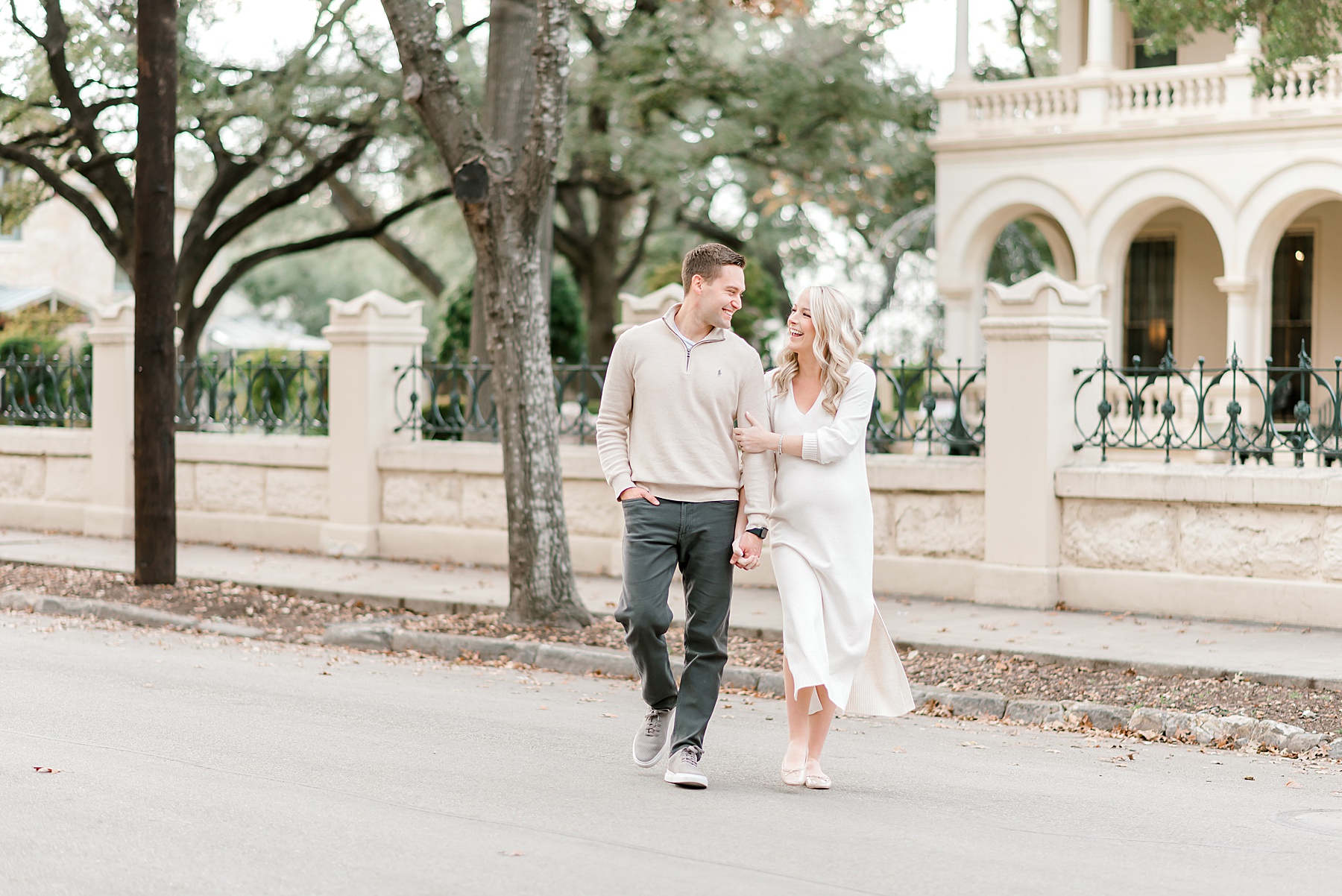 couple walk across street together 