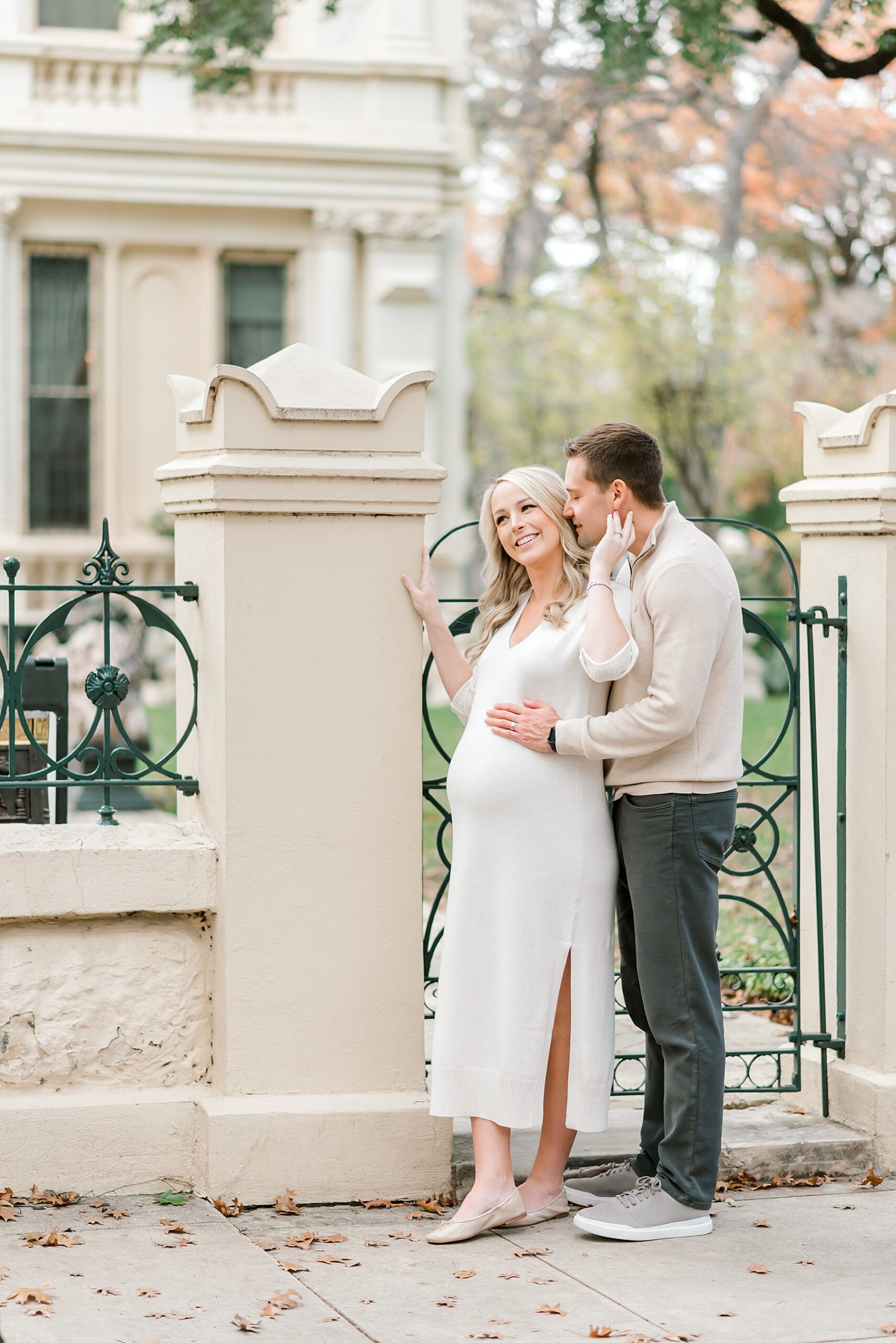 couple outside gate of building 