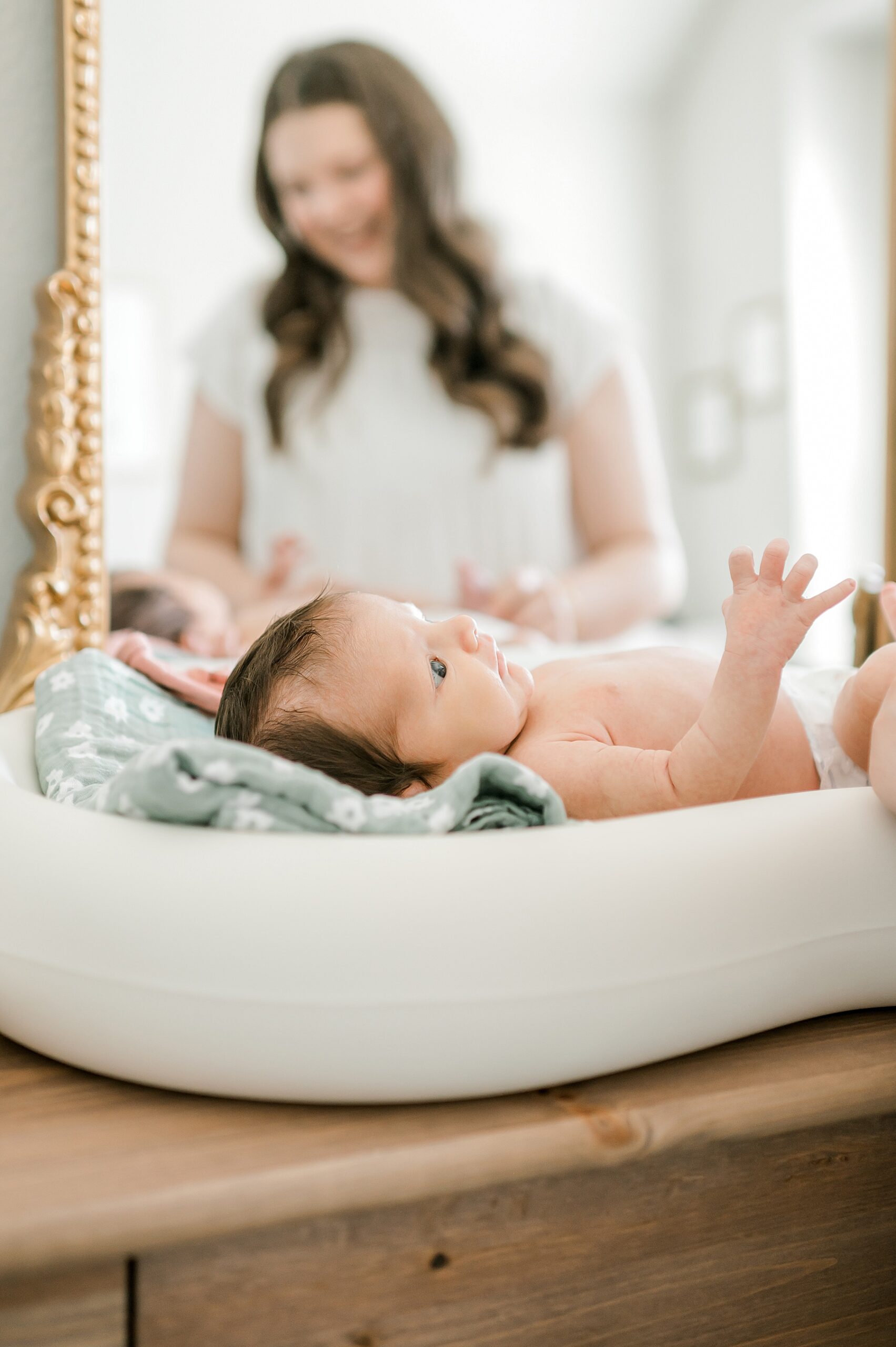 newborn getting changed in nursery
