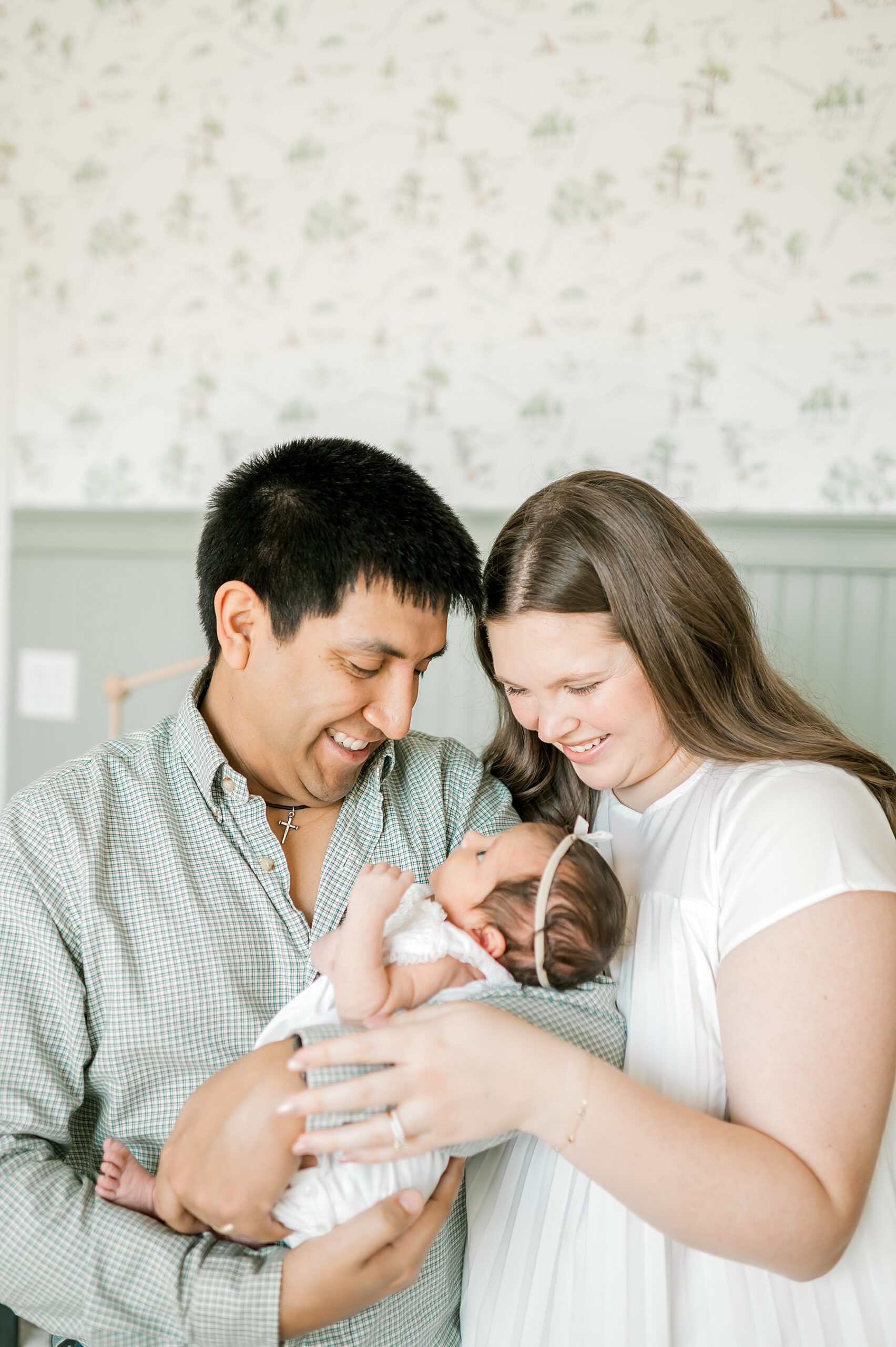 loving parents look at newborn