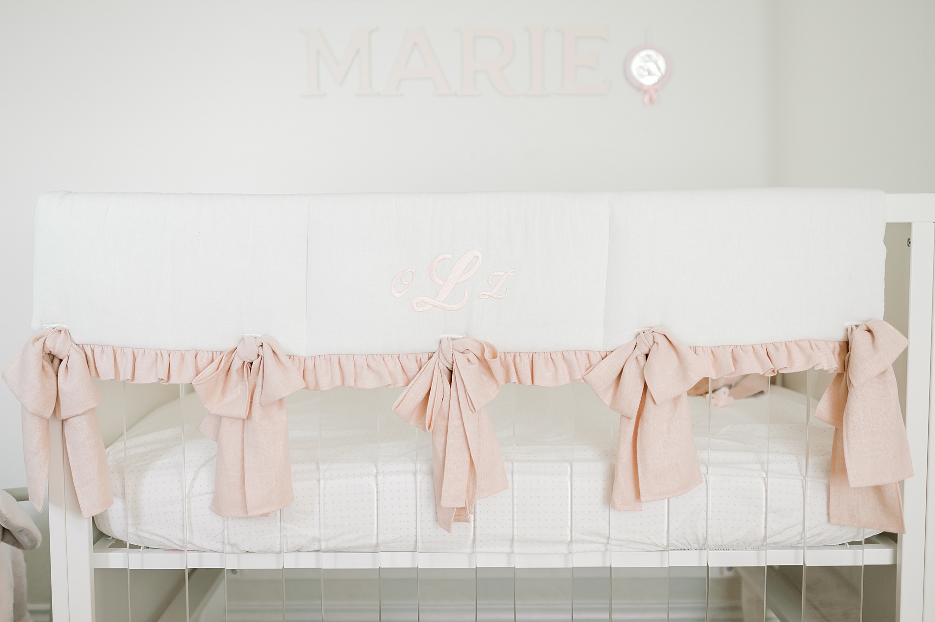 light and airy nursery with pink bow details