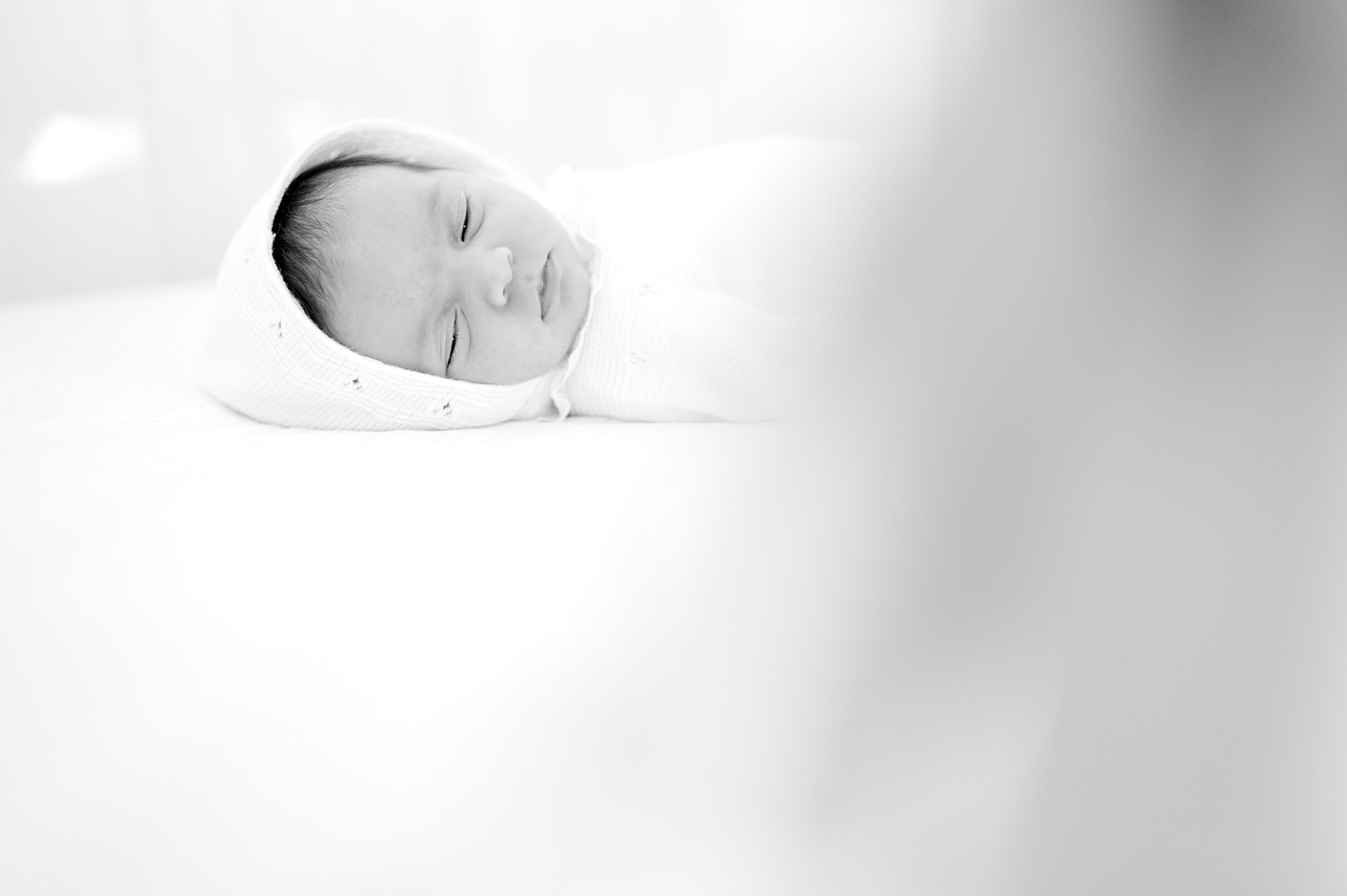 newborn sleeps in crib