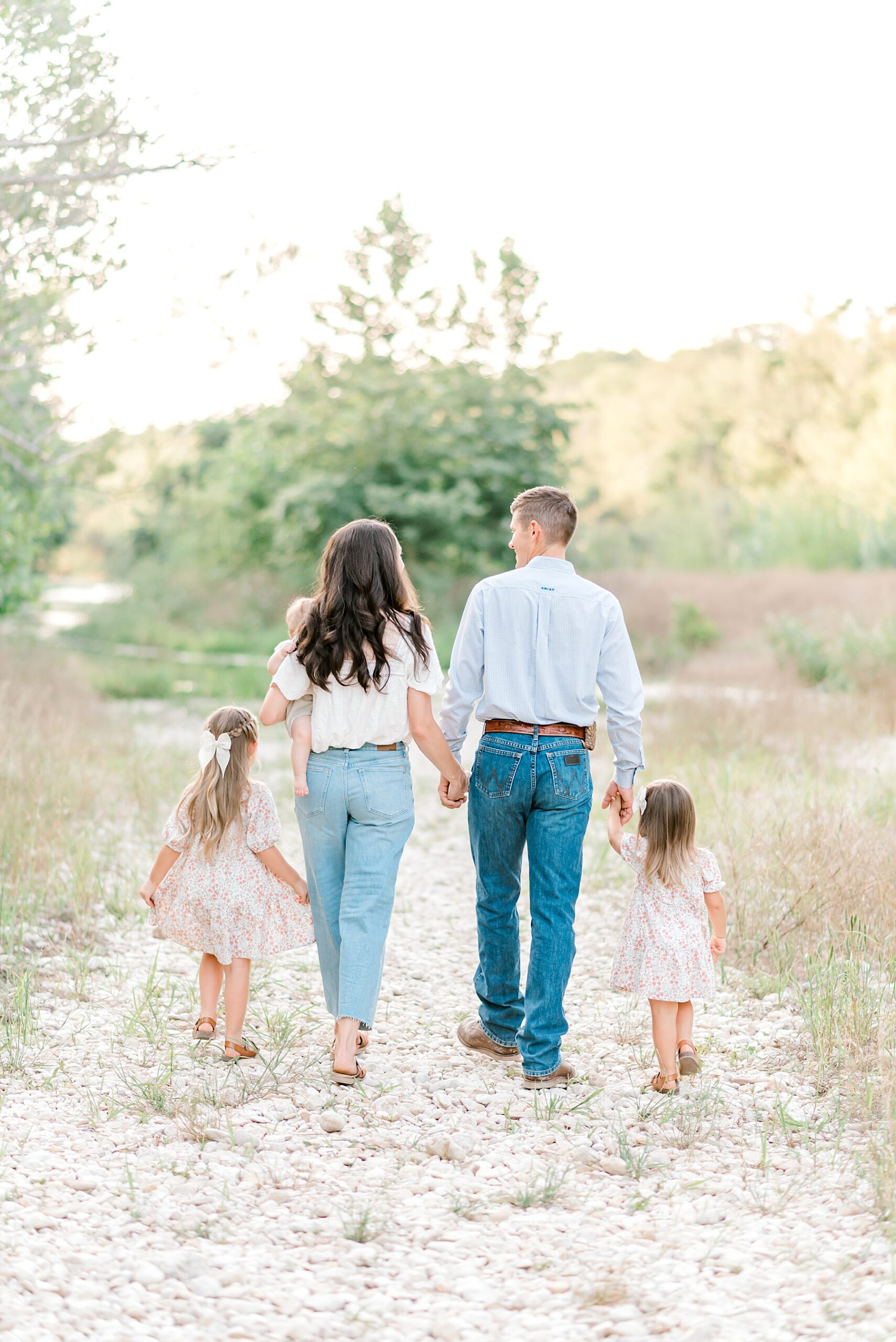 family of five walks togehter