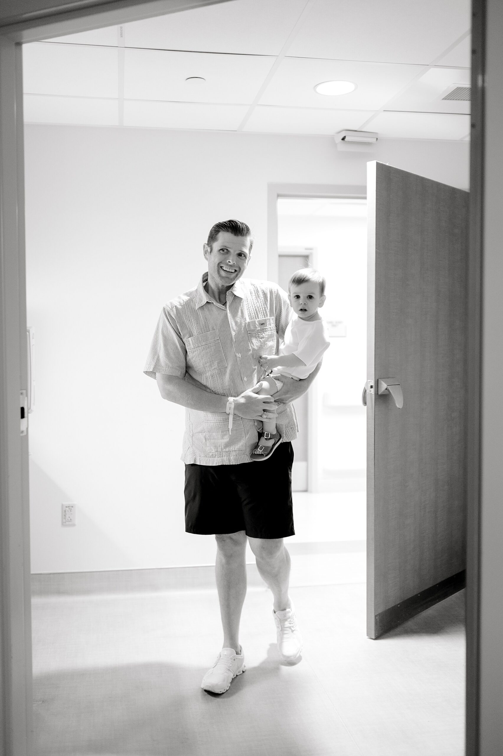 dad and big brother visit newborn