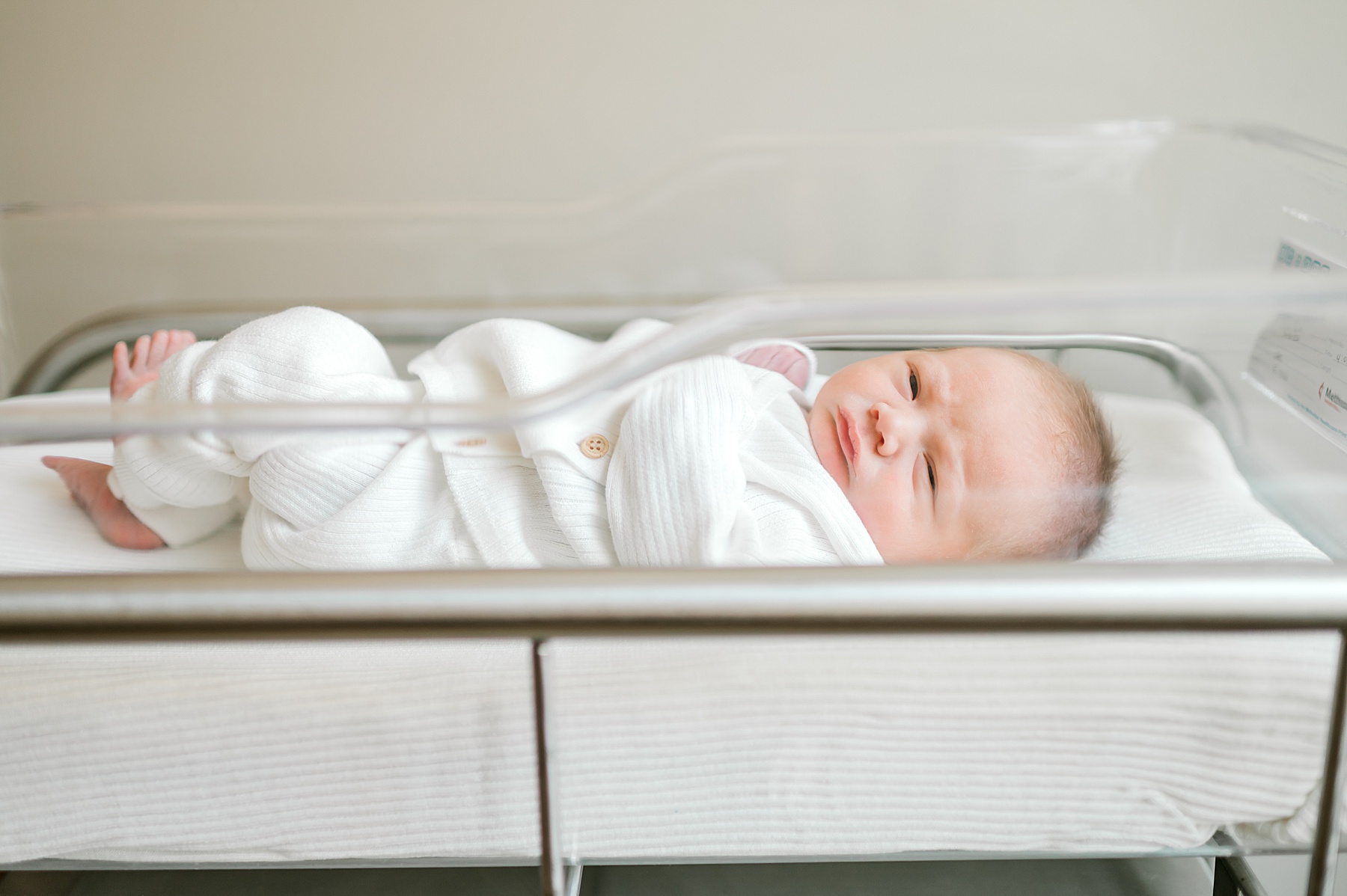 newborn in bassinet at hospital