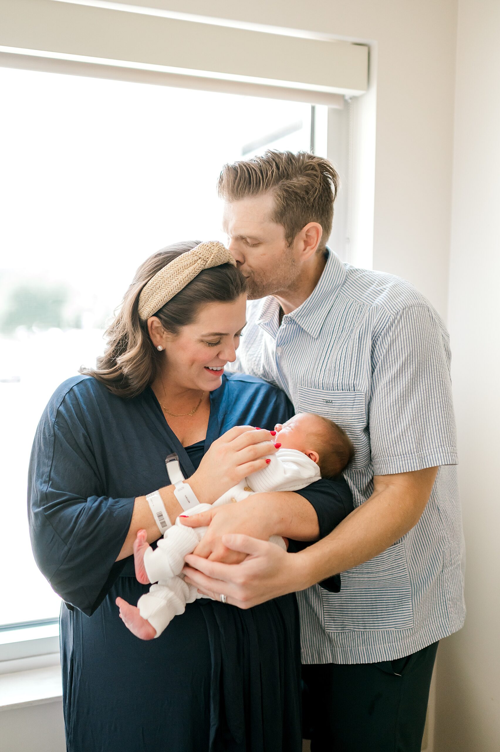 mom and dad hold newborn | Why Fresh 48 Sessions Are So Special
