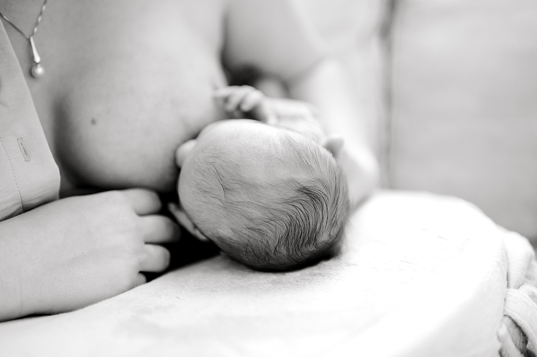 capturing nursing moments during in-home Lifestyle Newborn Session