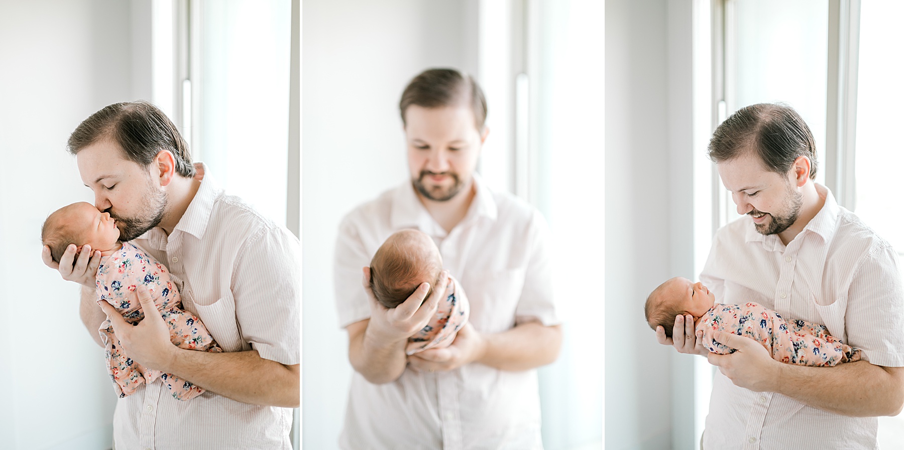 dad hols newborn in arms by natural light