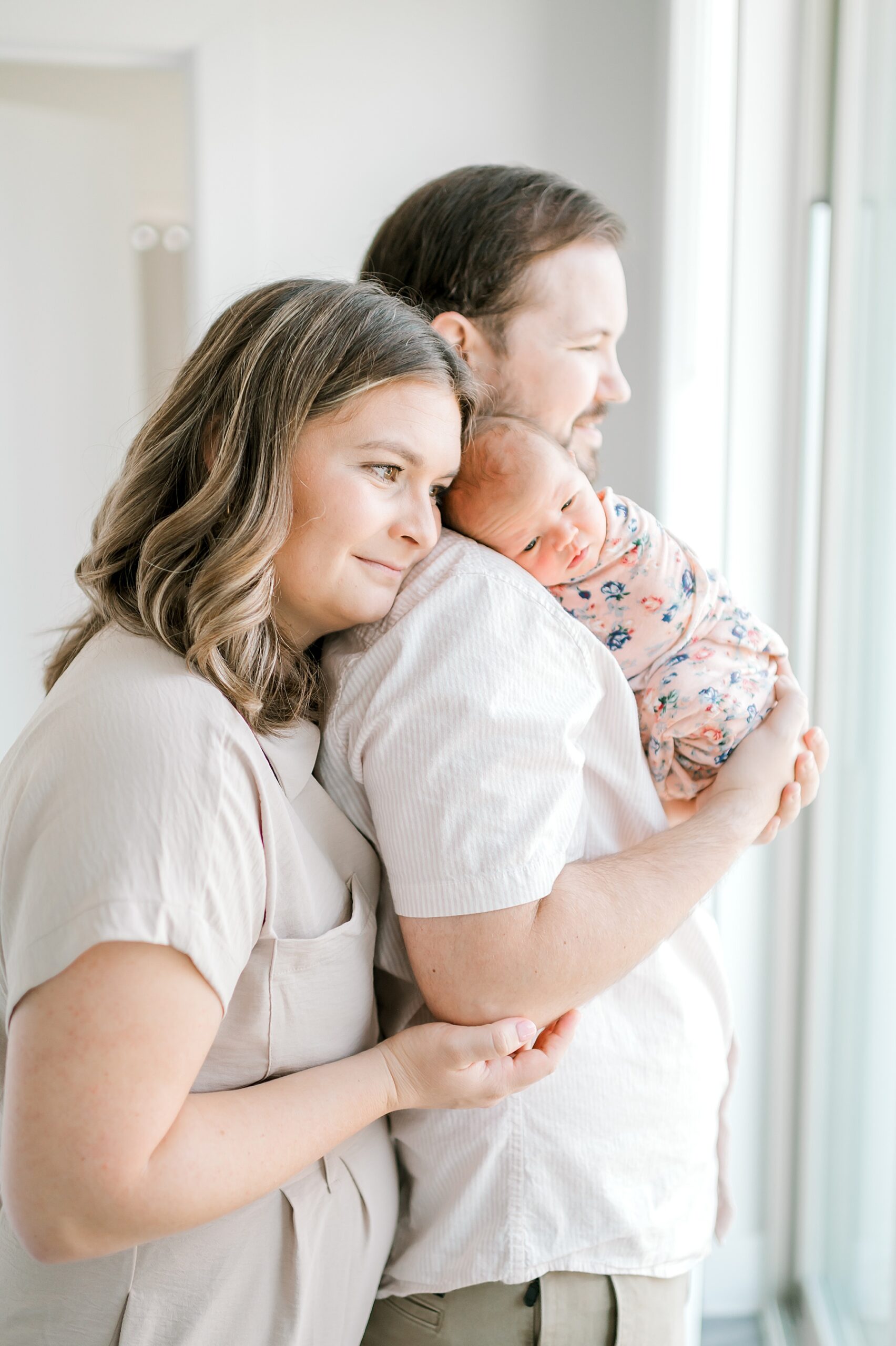 family of three during Relaxed Lifestyle Newborn Session