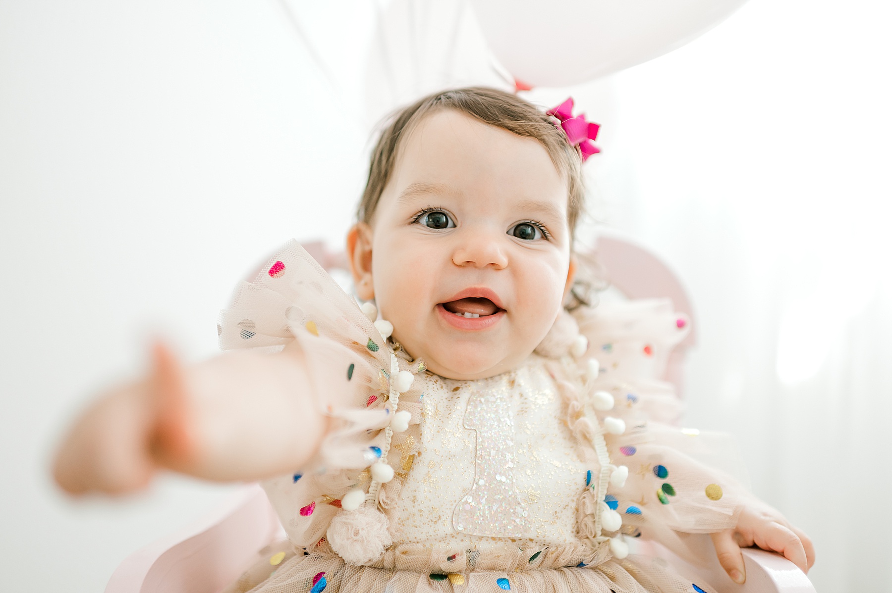 baby girl in birthday dress