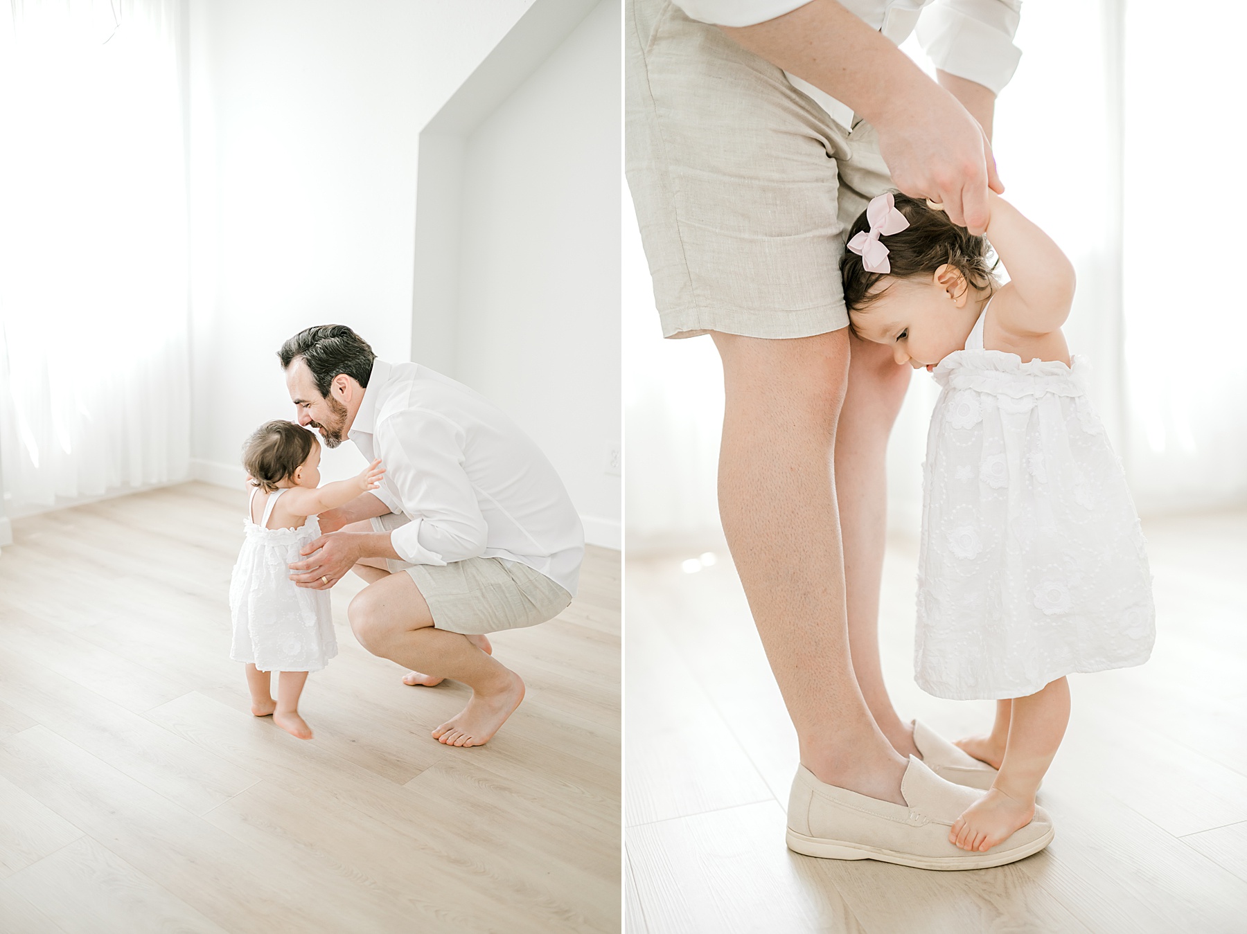 dad with little girl helping her stand and walk