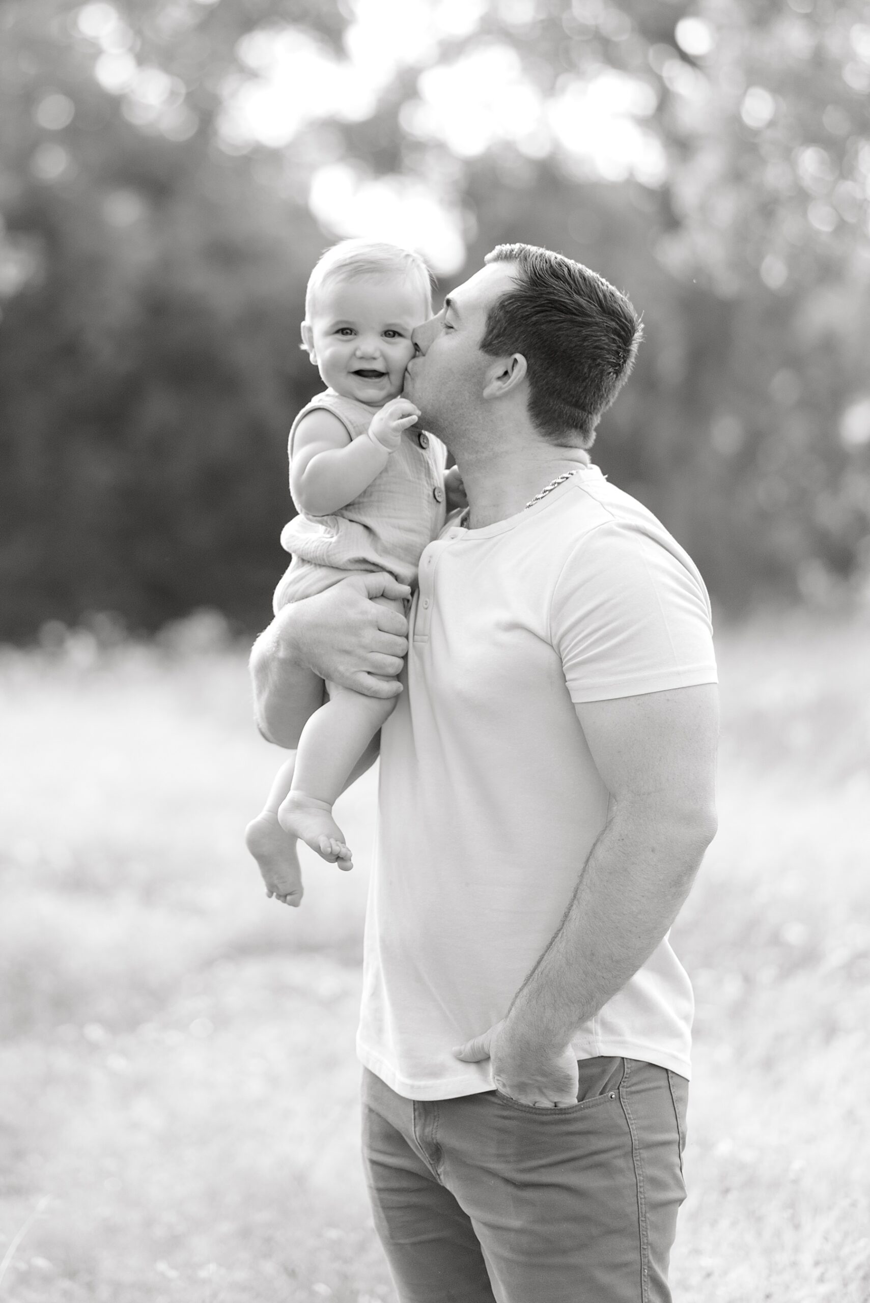 dad kiss his son's cheek during Sitter Session in Bulverde, TX