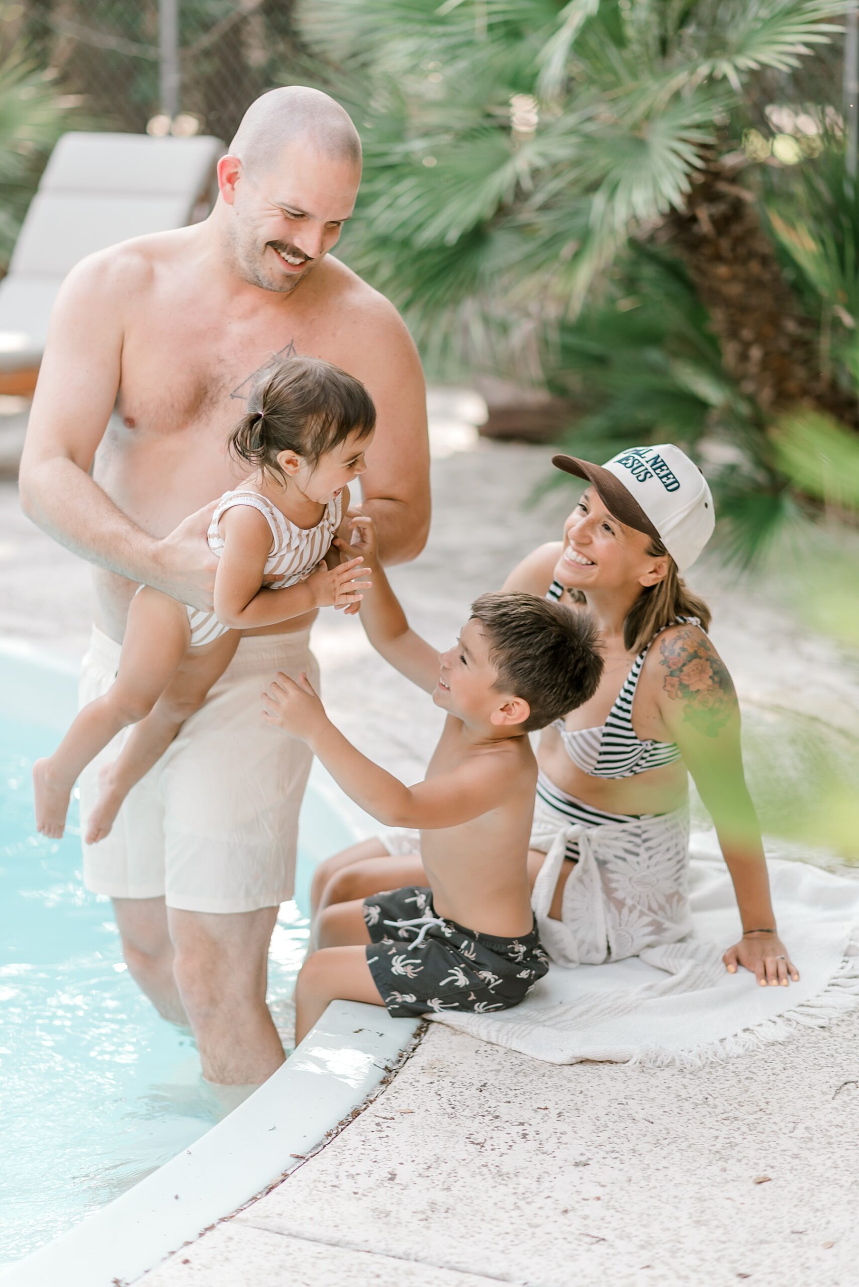 family of four gets in pool