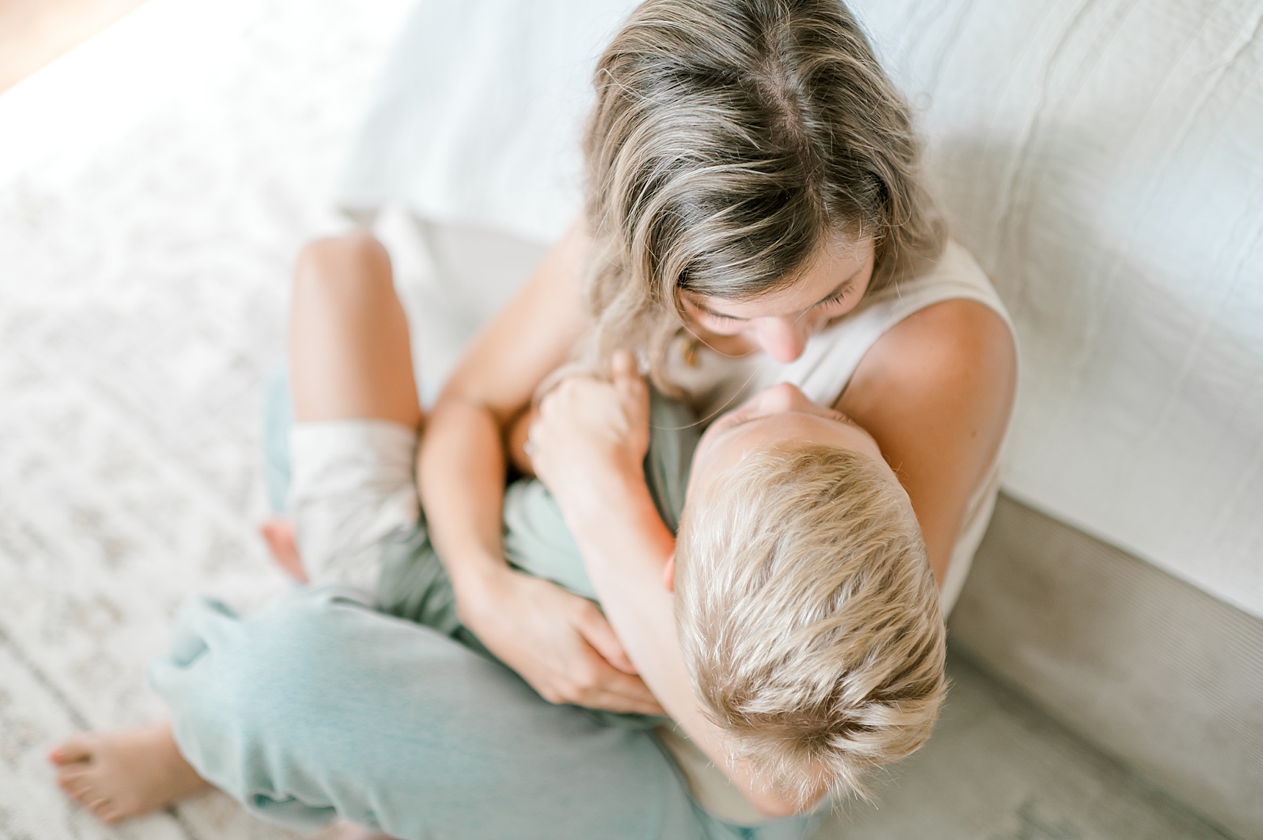 mom holds son in her arms