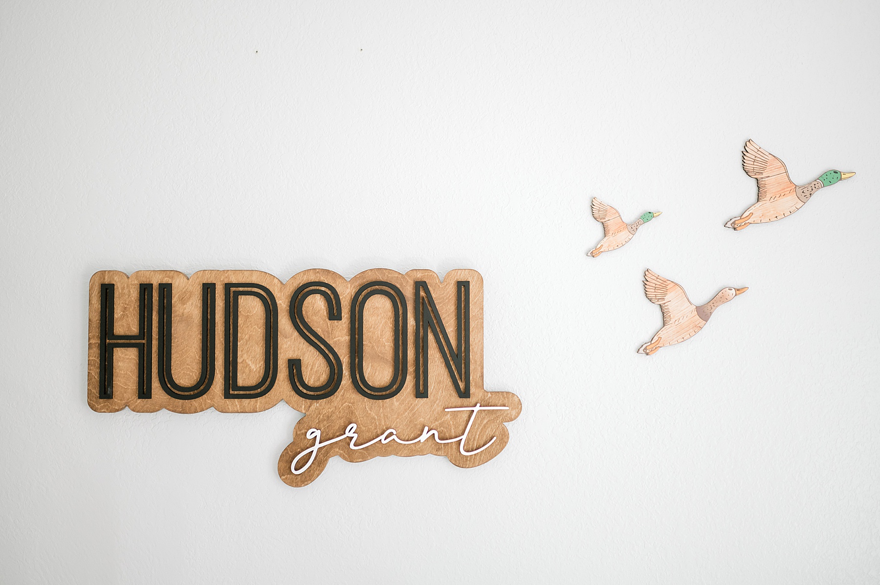 name on wall of boy nursery