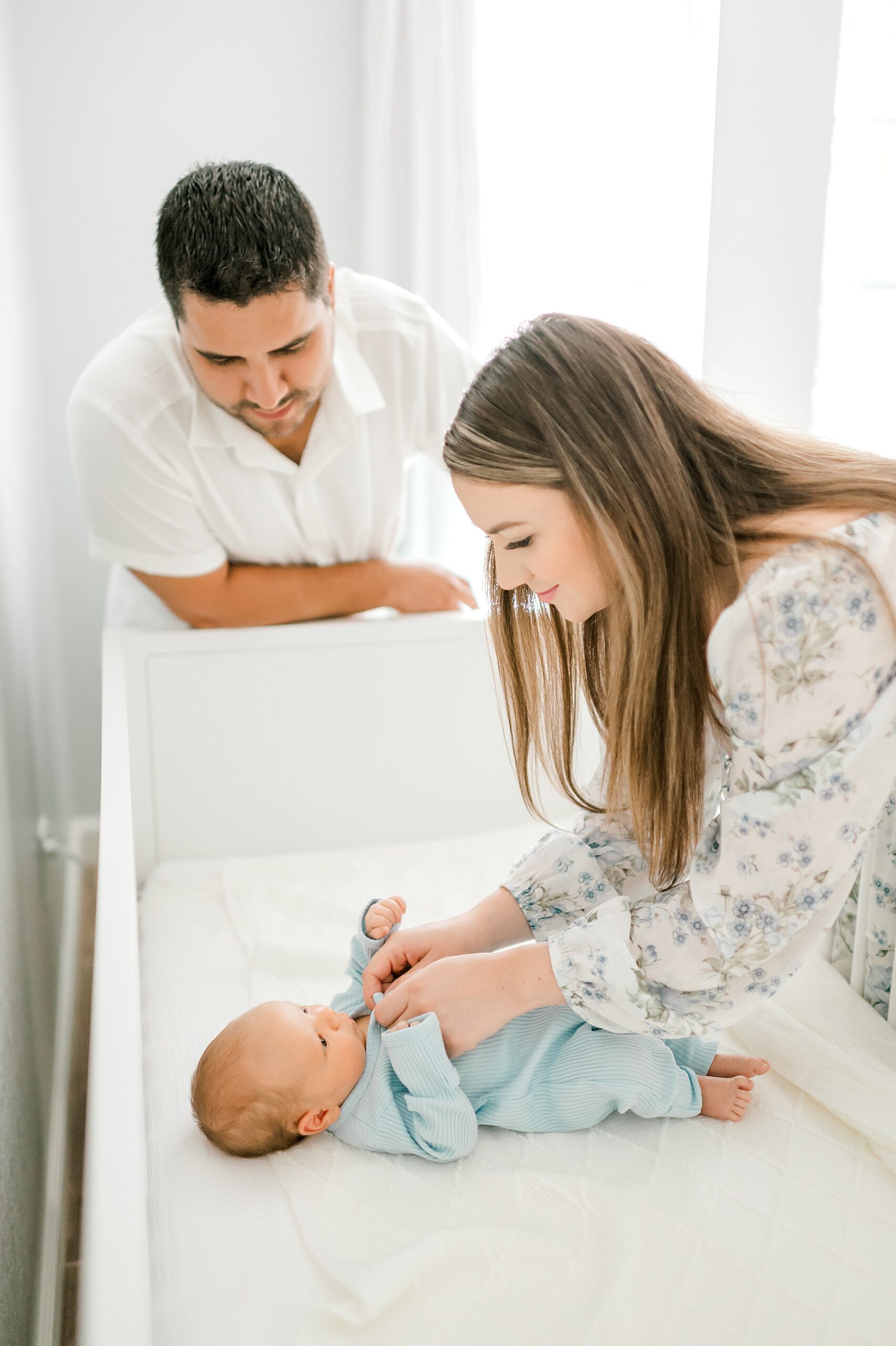 mom changes newborn 