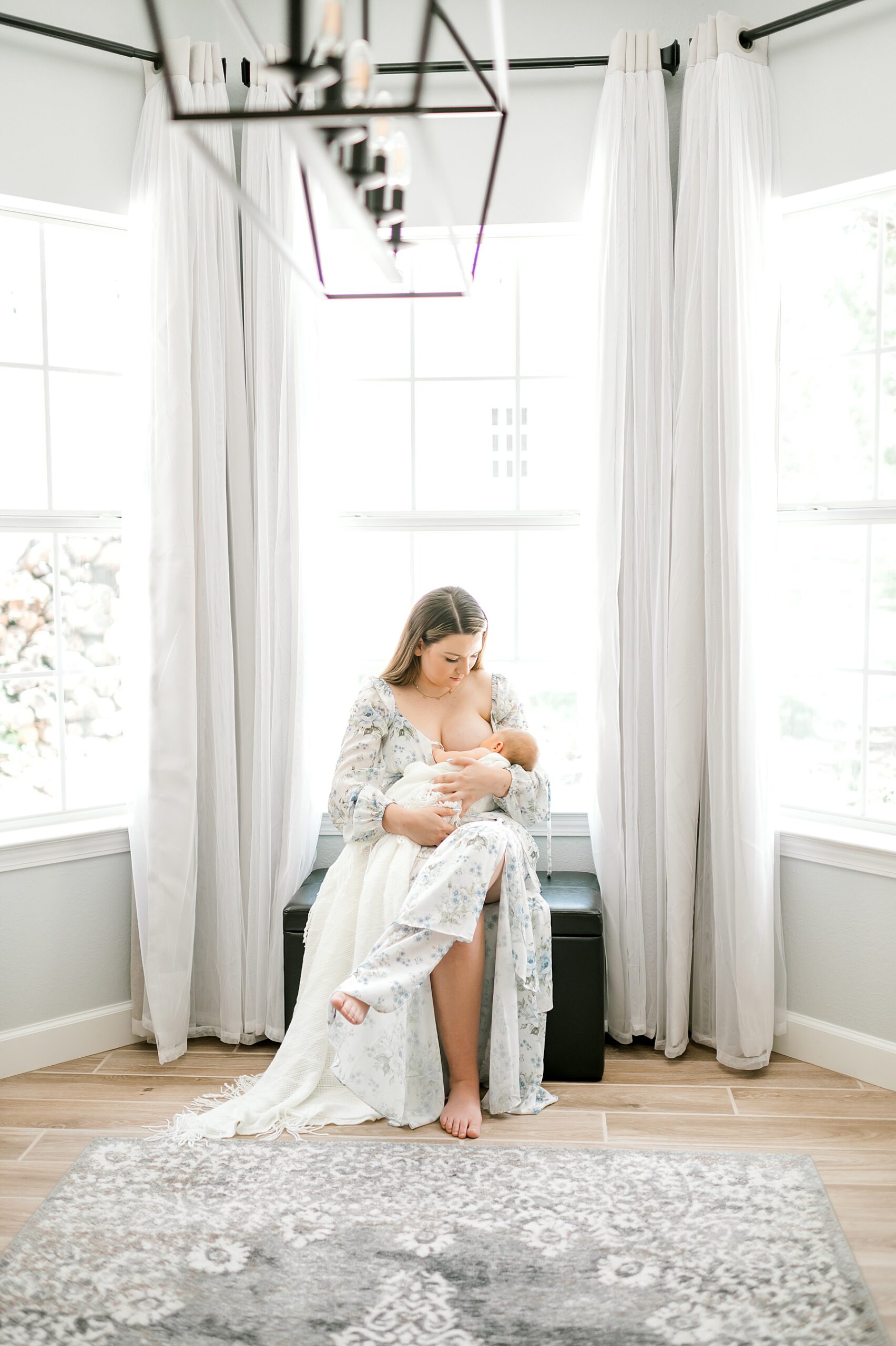 capturing nursing moments during in-home session in Canyon Lake, TX | Styling Tips for Newborn Sessions 
