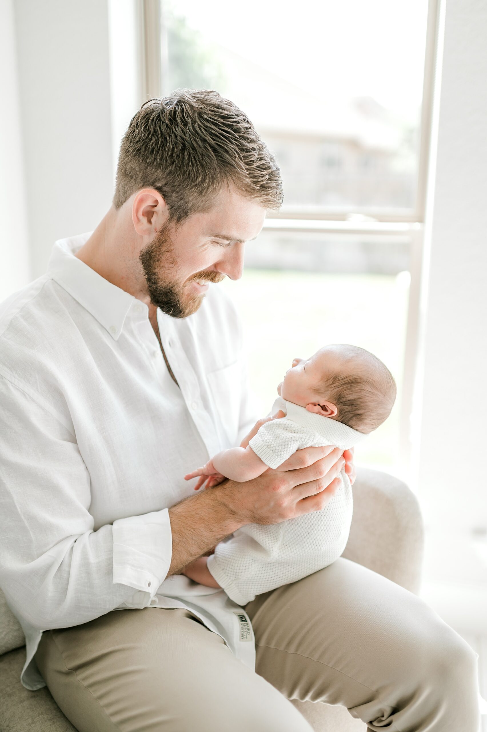 San Antonio newborn photographer captures dad holding newborn boy