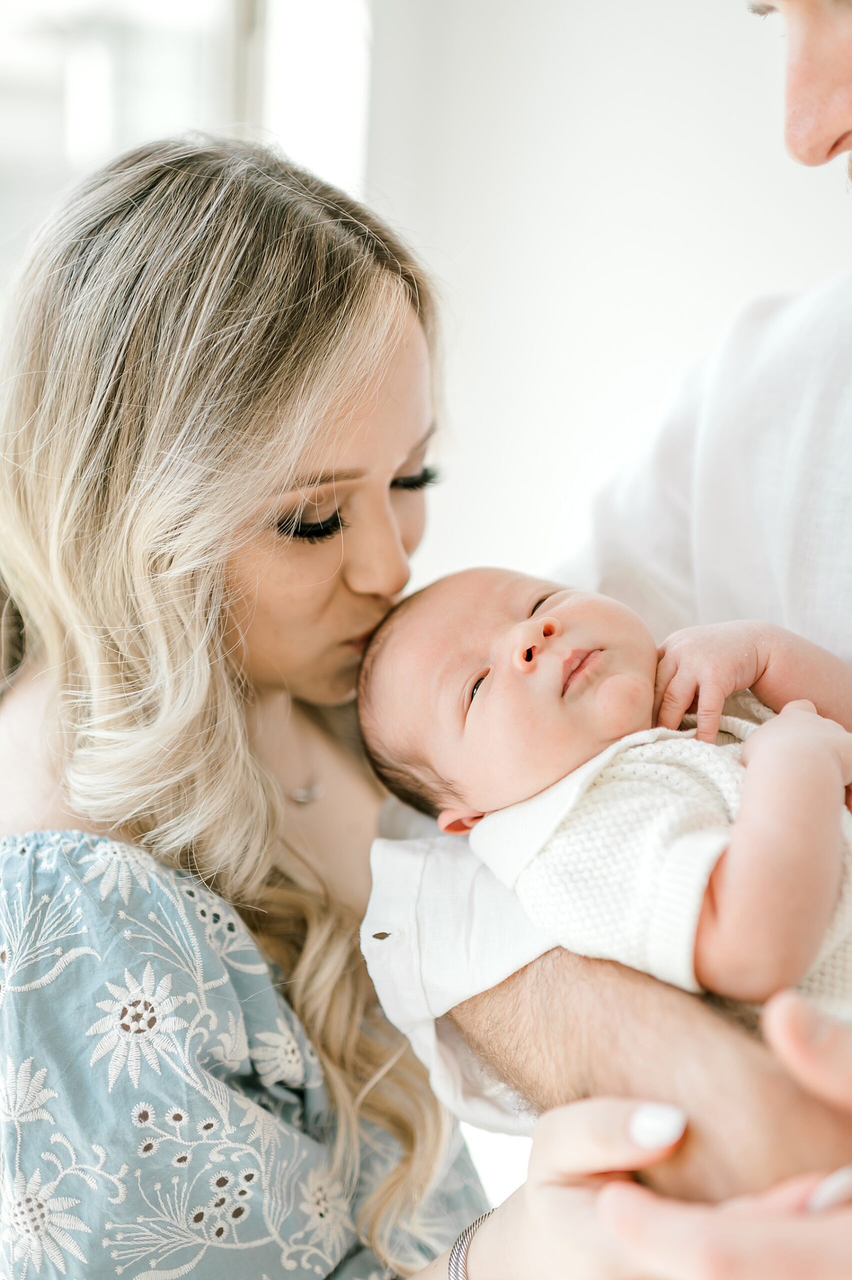 mom kisses baby boy's head