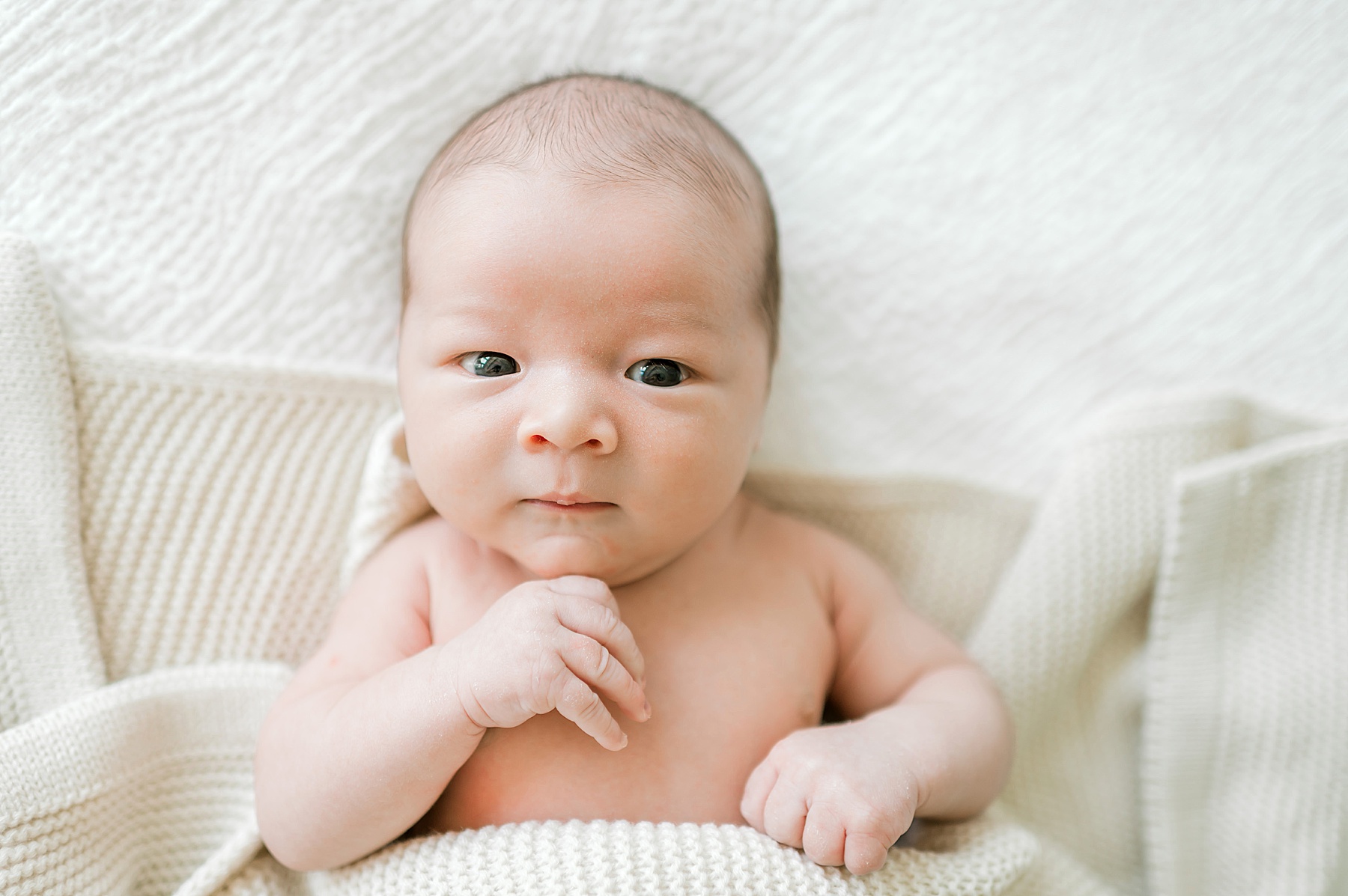 newborn boy with blanket