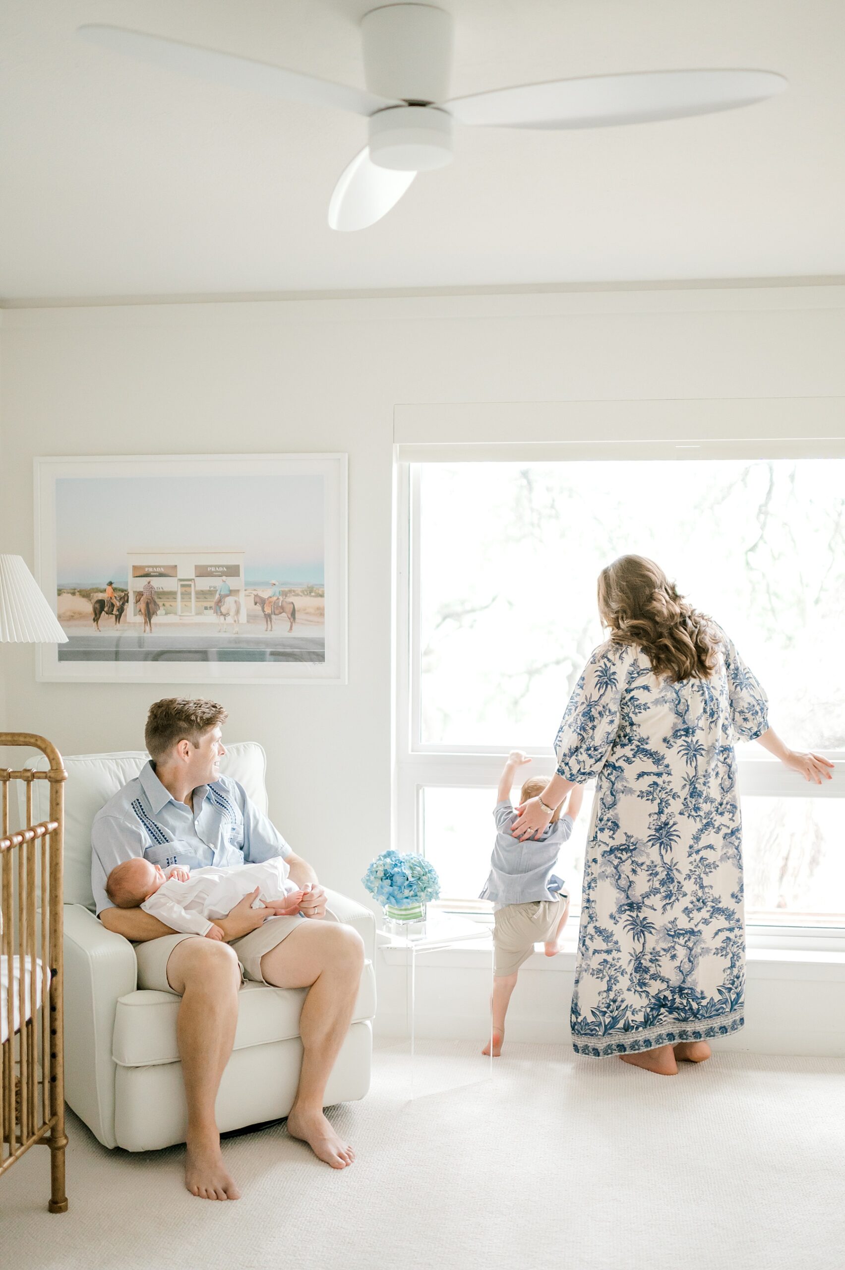 family of four in baby's nursery during San Antonio at home newborn session